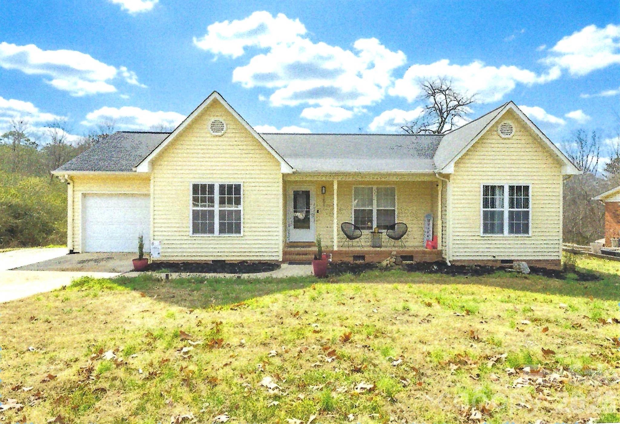 Charming ranch home featuring one level floor plan, open living and dining areas. The inviting living room offers a cozy fireplace, perfect for relaxing and entertaining. Recently remodeled kitchen boasts new appliances, providing a fresh, modern feel. Covered porch and large garage add room for a 'work area". A wonderful opportunity for first-time homeowners  or downsizing seniors seeking comfort, functionality, and value. This property needs some work but has great potential  - Needs some paint,  carpet and wooden floor refinished.