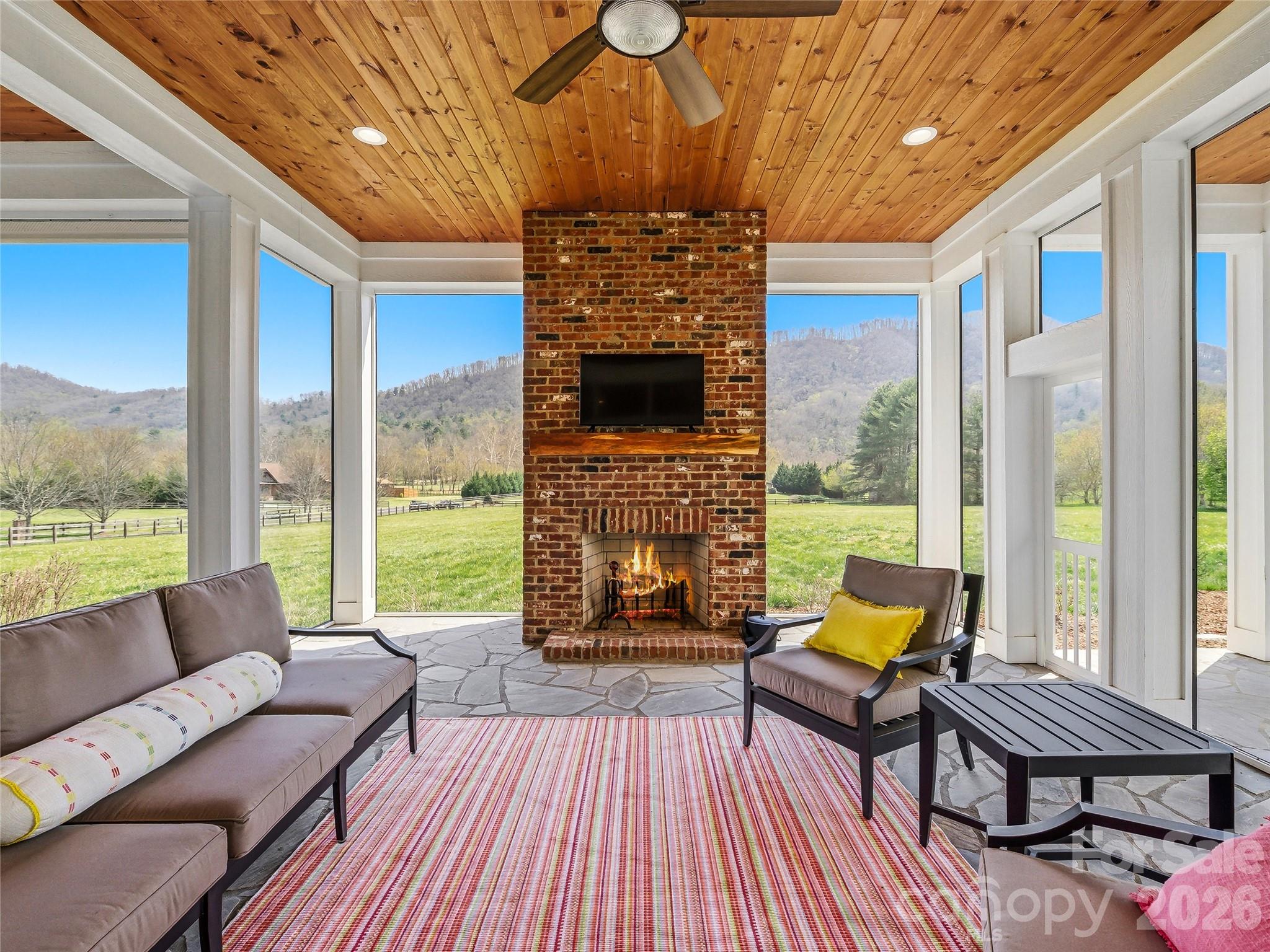 Luxury new construction completed in 2024, set on 3.47 acres of beautifully flat, usable land—an increasingly rare offering in the Asheville area. Designed for effortless living and an elevated lifestyle, this property blends refined finishes, thoughtful design, and exceptional versatility.
The home features a light-filled open floor plan that seamlessly connects the main living spaces to a stunning screened porch with a fireplace—creating the perfect setting for year-round entertaining. Two primary suites—one on the main level and one on the second floor—offer ideal flexibility for multi-generational living or hosting guests with comfort and privacy.
The level acreage is a true standout, providing the perfect canvas for a resort-style pool, gardens, or a fully realized equestrian estate. With allowances for up to three horses and available renderings to inspire your vision, this property offers a rare opportunity to create a legacy lifestyle property.
A detached guest house adds incredible flexibility as a private office, fitness studio, or creative space, while the detached three-car garage provides ample room for vehicles, storage, or hobbies.
Peaceful and private, yet conveniently located near Asheville, this is where modern luxury meets land, lifestyle, and limitless potential.