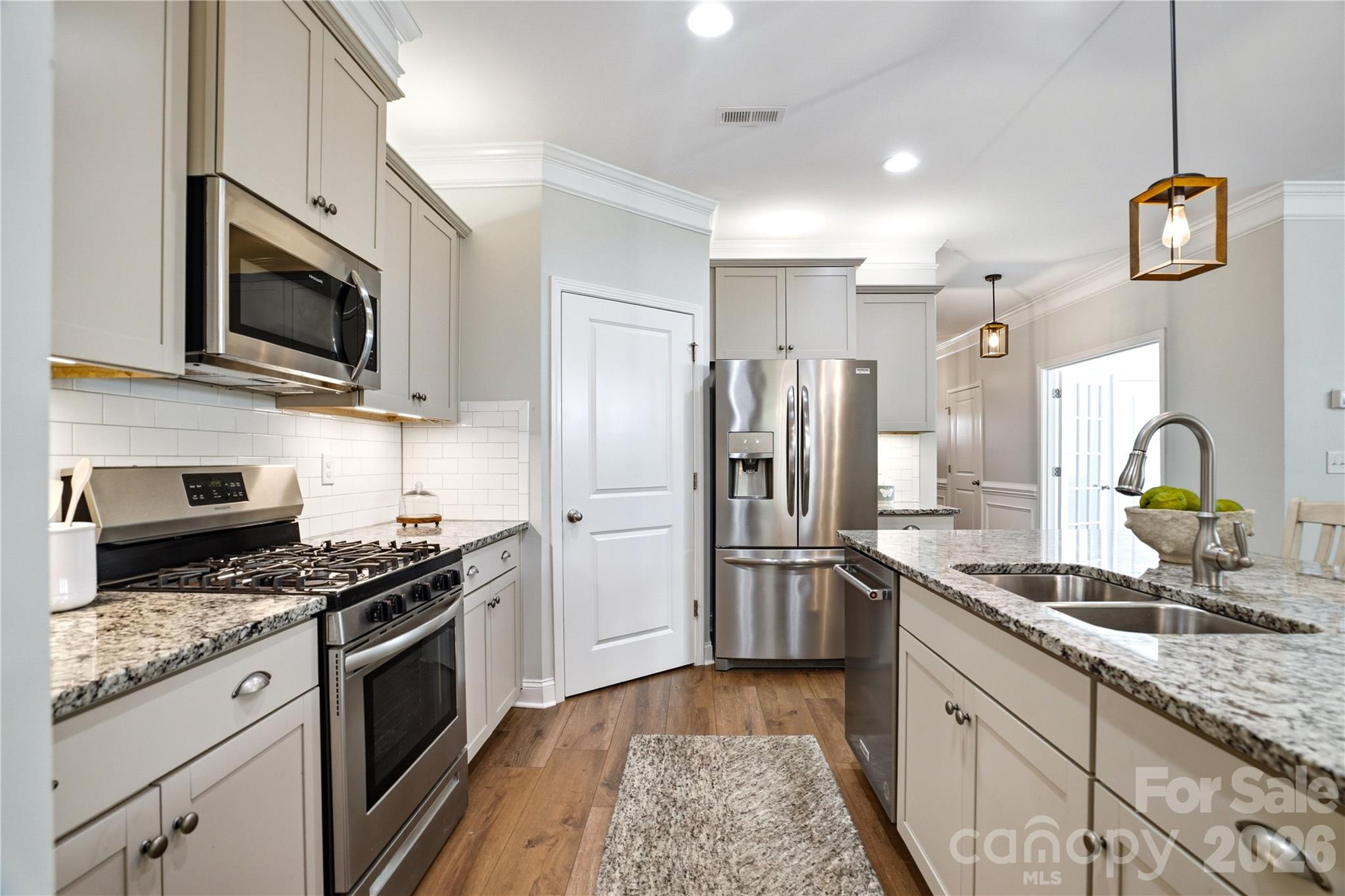 3 Bedrooms with a flex room and a secondary living space upstairs! Discover this beautifully maintained 1.5-story home in the highly desirable Covington at Lake Norman community. Thoughtfully updated and impeccably cared for, this move-in ready home offers the perfect blend of comfort, functionality, and charm. Featuring 3 bedrooms plus a bonus room/office, this versatile floor plan includes an upstairs loft/flex space with an additional bedroom and full bath—ideal for guests, a private retreat, or extra living space. The main-level primary suite offers convenience and comfort with dual vanities, storage and a walk-in closet. The heart of the home is the inviting open concept kitchen, and living space complete with a large island and cozy fireplace perfect for gathering and entertaining. Throughout the home, you’ll find ample storage along with tasteful updates including newer LVP flooring & carpet, updated light fixtures, epoxy garage floors and beautiful landscaping. Step outside and enjoy your own private backyard oasis. The current owners have invested extensively in the landscaping to create a peaceful outdoor retreat featuring irrigation, a screened-in patio, extended patio space with lighting, and a sunshade—perfect for relaxing or entertaining year-round. Located in a welcoming, community-focused neighborhood near Lake Norman, this home truly stands out for its condition, thoughtful upgrades, and pride of ownership. A rare opportunity to own a home that feels as good as it looks. Covington at Lake Norman offers a vibrant community with an outdoor pool, clubhouse, neighborhood events, and boat storage. Just minutes from public lake access and Westport Golf Club, and with easy access to Hwy 16, you’re only 35 minutes from the airport and close to everything Charlotte has to offer. 1% lender credit towards buyers closing costs available with preferred lender. The home is currently under a seller's home warranty.
