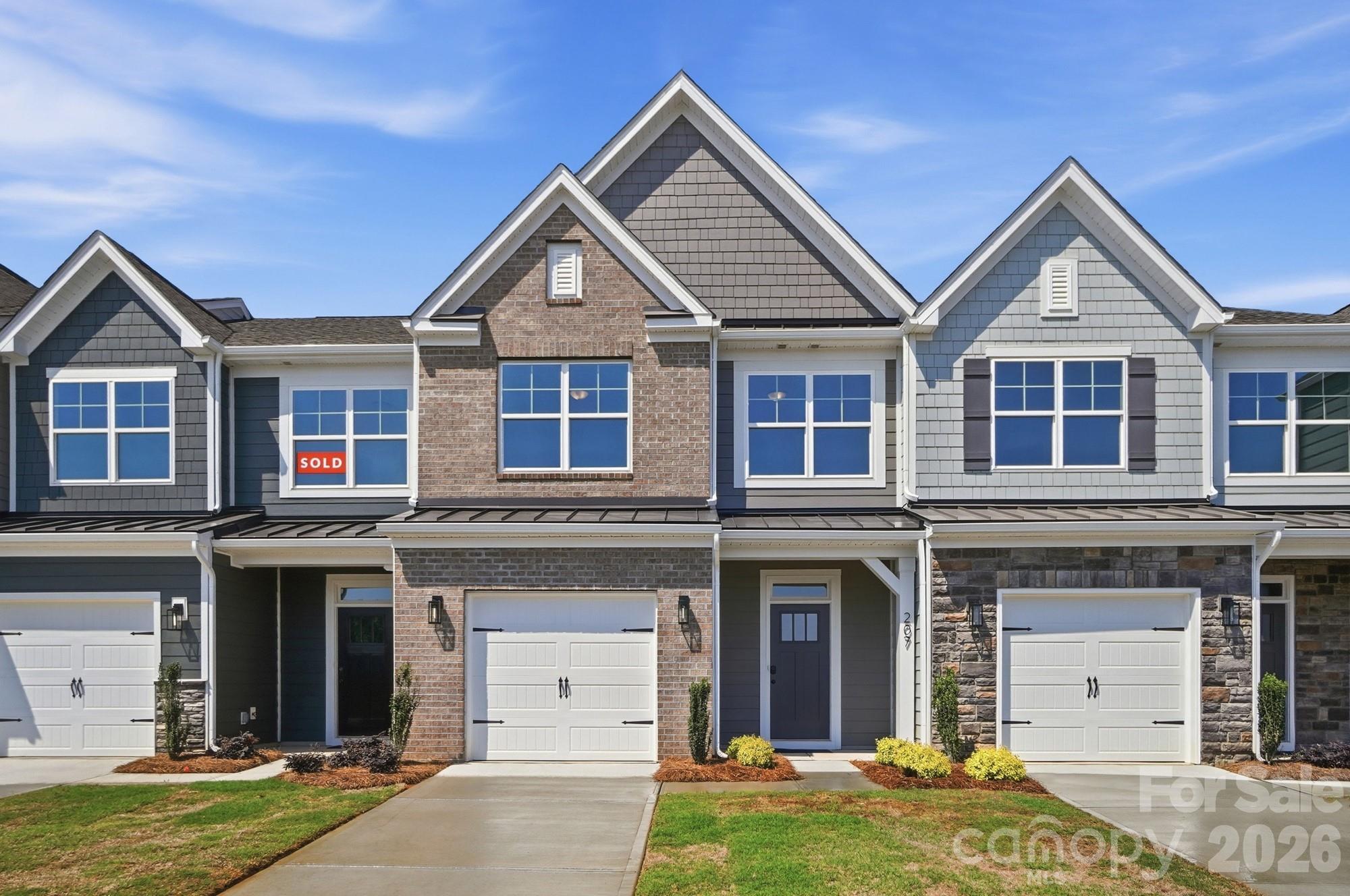This Ashland plan has 3 bedrooms, 2.5 baths, and more than 1,800 square feet of living space. Enter the home through the foyer with tray ceiling, Craftsman-style trim, and a convenient, beadboard drop zone to see the open kitchen, dining area and family room that walks out to a covered porch. The kitchen features white, Shaker-style cabinets and quartz counters, a spacious island, tile backsplash, and stainless appliances, including a gas range. The open main floor has beautiful and durable Enhanced Vinyl Plank flooring throughout. Stairs with composite treads and metal balusters lead upstairs to the loft, bedrooms, full baths and laundry room. The primary bath has a tiled shower with bench seat & semi-frameless door, dual-sink vanity, and linen closet. The upstairs full bath has a tub/shower combo. All baths have white cabinetry and white quartz counters. Walking distance to shops, eateries, and other conveniences. Visit today!