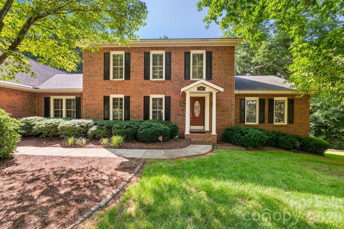 Executive home located in one of Morganton's premiere neighborhoods. Situated on a generous .95 acre lot, this spacious home with 4 bedrooms, 3.5 bathrooms offers the perfect blend of comfort, functionality and privacy. The family room showcases a gas fireplace and built-in bookcases (TV stays). The well-appointed kitchen has quartz countertops, SS appliances, built-in desk, under cabinet lighting and opens into a breakfast area with built-in wet bar. Laundry room is conveniently located adjacent to the kitchen and 2-car garage. Off the breakfast area French doors lead to the composite deck with a retractable awning. For more formal gatherings, the living room has plush carpet and the dining room features beautiful hardwoods and is located off the foyer with a guest 1/2 bath. Primary en-suite on the main level offers a walk-in tiled shower, built-ins and plenty of closet space. Three additional bedrooms and a full bath are located upstairs. Partially finished basement area is heated via mini-split and has a full bath and kitchenette. Unfinished area is heated and cooled and has more storage area. Outside enjoy a peaceful setting with a fenced in back yard and mature trees for privacy. Plantation shutters throughout home. Water filtration system. Conveniently located in the city limits of Morganton and just minutes from downtown, shopping, medical facilities and the Greenway. No HOA dues, Duke Energy, PNG, city water/sewer/trash. Possession and/or closing to occur on or after 9/7.
