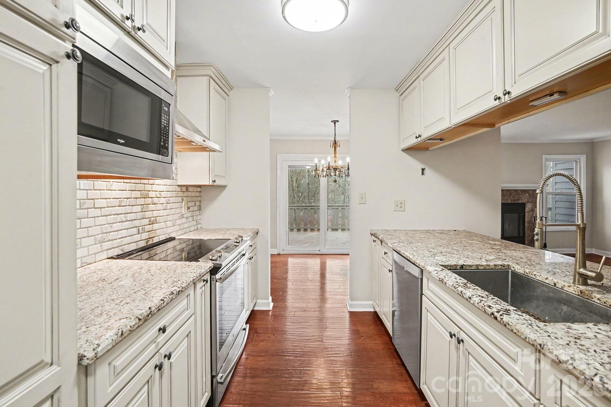 ***$2,000 Floor Credit with acceptable offer ***$5,000 Lender Credit available when you get approved with Preferred Lender*** Inspection Report is available upon request*** Please review driving directions upon arrival*** Welcome to the Dogwood Hills neighborhood, just minutes from downtown Fort Mill and surrounding popular Ballantyne, Pineville, and Charlotte. This end unit Condo is situated in a quiet wooded area and features a 2022 year roof, an encapsulated crawlspace, large deck, an outside storage area, and two parking spaces. This low maintenance condo offers easy living with the HOA handling the exterior maintenance, roof, lawn care, termite protection and garbage service. You The home is move in ready with **Professionally Painted Walls, newly installed carpet, and professionally deep cleaned**. You will love the galley kitchen that houses the laundry, custom cabinetry, granite countertops, and stainless steel appliances. The dining area and living room blend creating a large open area with lots of desirable natural lighting. The large living room features a stone faced wood burning fireplace, a huge wall to hang a flat big screen TV, and stool seating around the kitchen countertop. This is a great layout for entertaining guests. Lastly, enjoy three spacious bedrooms with walk in closets- including the primary bedroom and bathroom. Schedule your tour today!