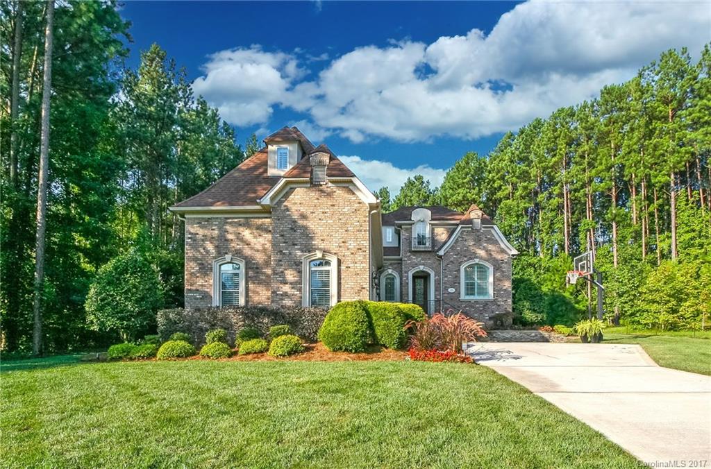 309 Palm Cove Way, York SC. This Fully Bricked Custom Home is Priced Right & a Hop, Skip, & Jump from Lake Wylie w/Clover Schools.  Nestled on a Wooded Lot w/Private Back Yard, this Upscale Home has an Open floor Plan w/Master on Main. Enjoy a Spacious Chef’s Eat-In Kitchen w/Granite, SS, Tons of Cab & Formal DR for Ent. Crowds. Built w/the Highest of Standards this Great place offers Newly Installed High-end Appl, Lighting, Shutters, Fence, Sod/Irrigtn, Scr. Porch, Rinnai WH, Tile, & Much more.