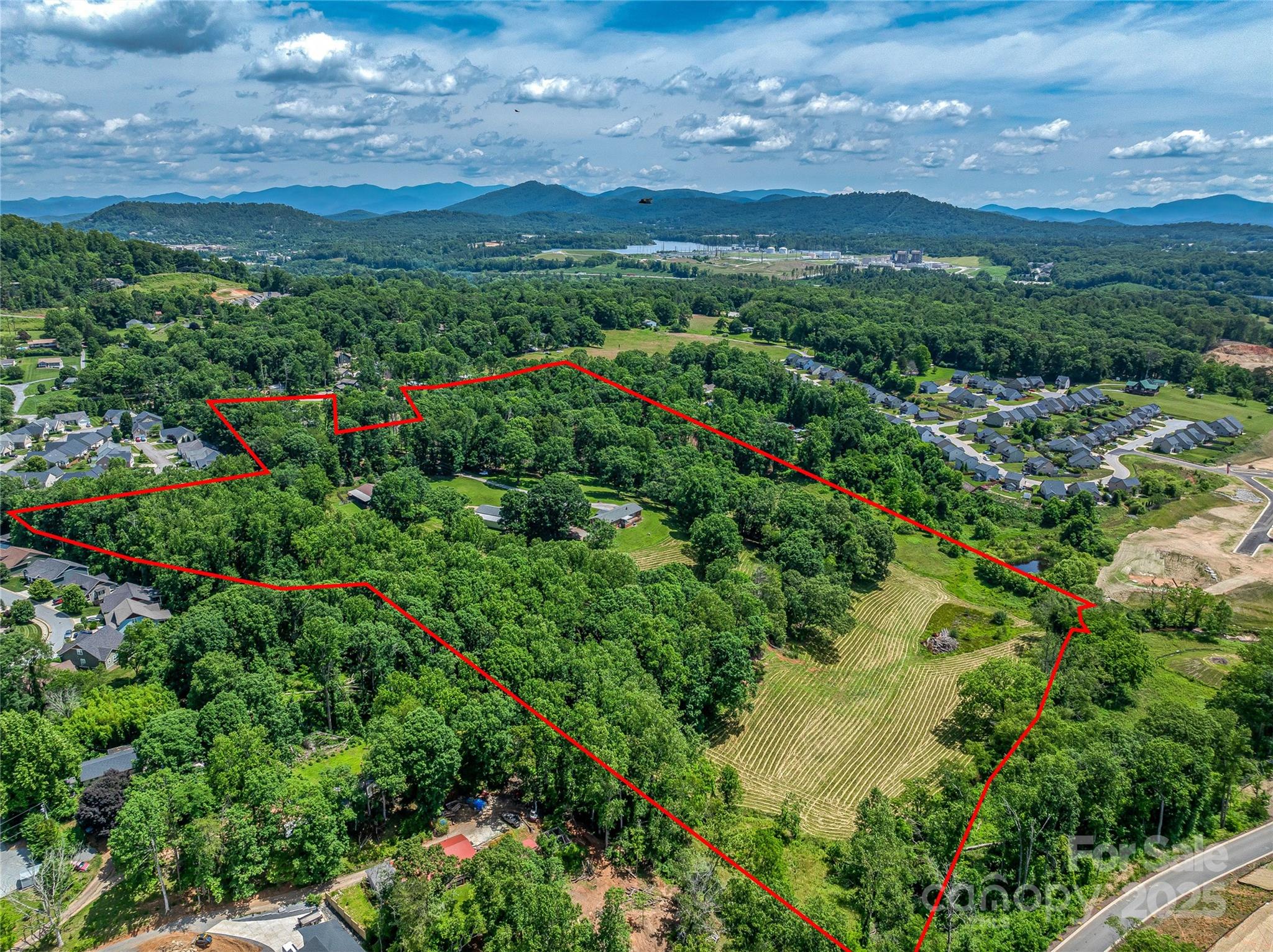 Attention Developers and Contractors! Rare opportunity to acquire 27.54 acres zoned EMP in the heart of Arden with great road frontage and topography, three phase power on site, city water, gravity flows to 10” sewer main, fiber and natural gas already in place. This prime development site is ideal for single-family or townhome development.  Enjoy super convenient access to Asheville and all its amenities, while benefiting from a desirable, rapidly growing location.  Major subdivision ordinance minimum lot size is currently 5,000 SF, higher density will require a PUD1 approval. For single ownership/ rental product, 12 units per acres are allowable as of right. Showing by accompaniment only; please make appointment.