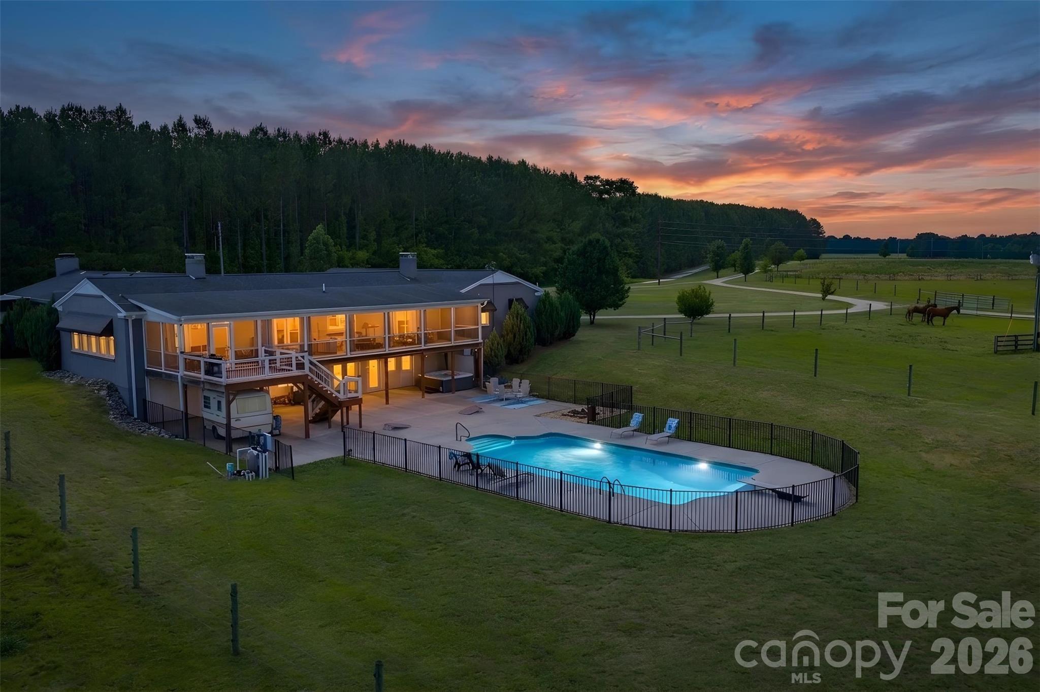 Welcome to 1425 Hobson Road, an established, move-in ready equestrian property set on 11.29 acres in Cleveland, North Carolina. Designed for both everyday living and a functional horse lifestyle, the 5-bedroom, 4.5-bath home offers 3,713 square feet with hardwood floors, open dining areas, a spacious kitchen with granite countertops, and multiple gathering spaces, including a sitting room, keeping room, and great room with a wood-burning stone fireplace. The primary suite opens to a covered private deck overlooking the pasture, while the guest bedroom wing and walk-out basement provide flexible space for guests, hobbies, fitness, or future build-out.

Equestrian amenities are already in place, including a separate gated gravel drive to the barnyard, metal barn with concrete aisle, barn security system, 6 stalls, soft stall systems, fans, windows, and a hot and cold wash station with tankless hot water. A covered 60 x 120 arena with LED lighting, clay base, rock and screening, and magnesium flakes for dust control makes this property ready for year-round riding and training.

Outdoor living is equally inviting with a vinyl saltwater pool, diving board, wrought iron fencing, large concrete patio, fire pit, and extra-large screened porch. With a peaceful rural setting, local events, a welcoming small-town community, and convenient access to nearby amenities, 1425 Hobson Road offers a turnkey equestrian lifestyle without feeling far from everything you need.