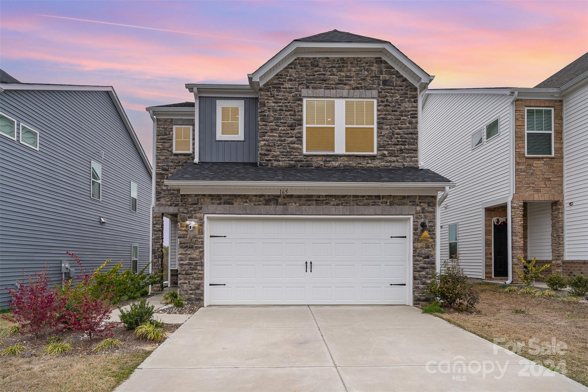 This gorgeous stone front home is completely move-in ready! Well-designed with a bright, open living area. Gourmet kitchen with beautiful white cabinetry & granite countertops, white tile backsplash, spacious island, gas cooktop, wall oven & microwave. Stainless steel appliances including a newer stainless steel refrigerator! Pantry & storage closet off of the kitchen. The upper floor includes the primary suite, 2 additional bedrooms, additional full bathroom, laundry room & loft. The Loft could make a great sitting area, play area or office space. The primary suite has a spacious bedroom, bathroom with beautiful quartz countertops, white cabinets & tiled shower. Large walk-in closet with window. Laundry room is easily accessible, with a newer washer & dryer! White faux wood blinds on the windows. Attached 2-Car Garage with MyQ app access. Camera doorbell & garage camera. Conveniently located to Kingsley Town Center, Anne Springs Greenway & highly-rated Fort Mill schools. A Must-See!!