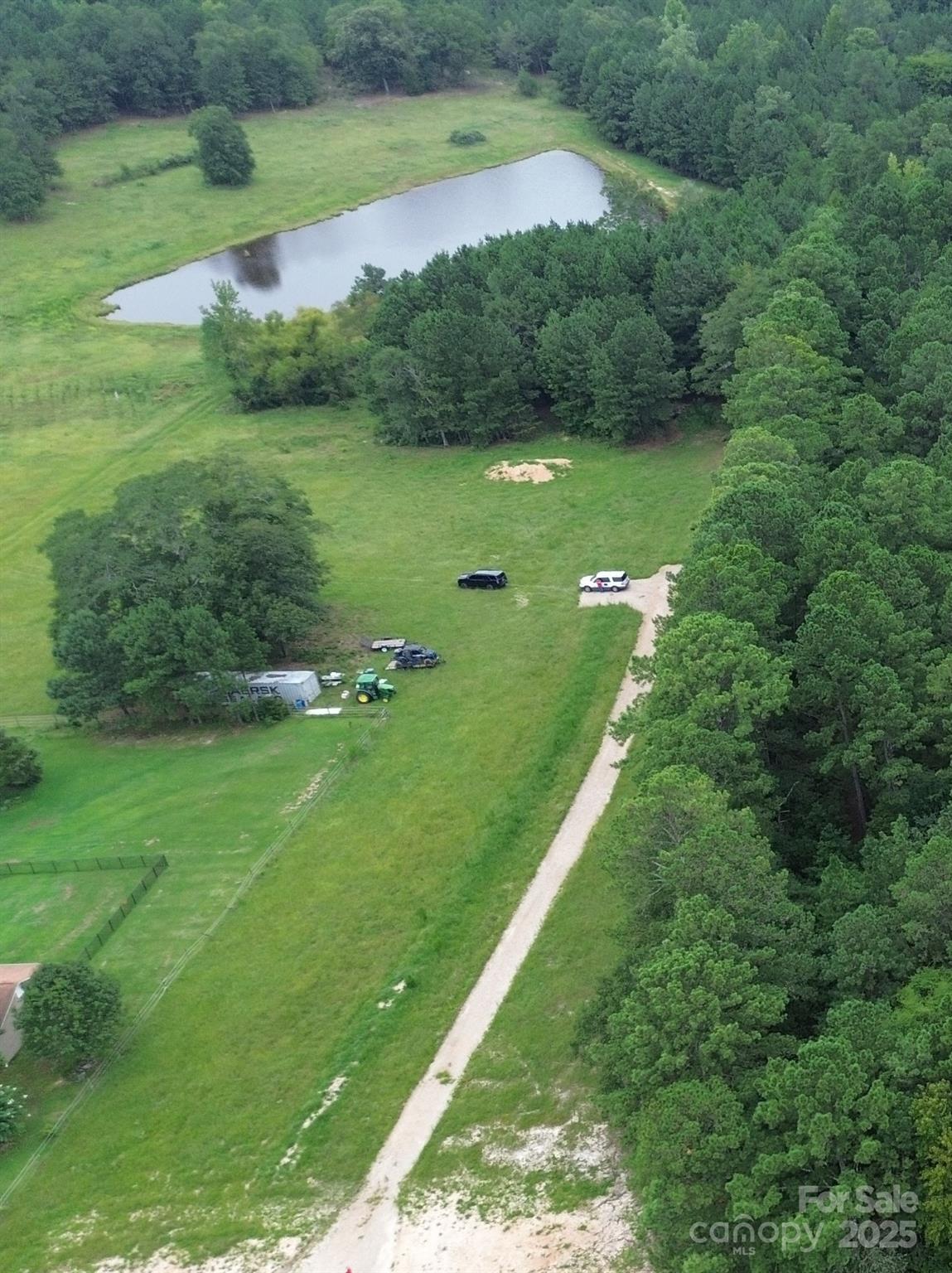 Priced to sell now!!!  Fantastic location of this 23.18 acre tract less than 1/2 hr from Charlotte, NC and 1 hr from Columbia SC right near I-77!!.  This picturesque land has the perfect blend of privacy but has development potential boasting natural beauty with open fields, some rolling hills, cleared areas and lots of wooded areas with mature timber.  It also includes stocked & spring fed pond with spillway.  Zoned RUD, but taxed as farm use. Property will be also be cross referenced in MLS as a Commercial Listing MLS#4294620 due to available zoning.  Call for appointment to get your private tour!  Survey available upon request.  Buyers are encouraged to contact York County Planning and Development to confirm that "your" intended use can be approved under the RUD zoning.