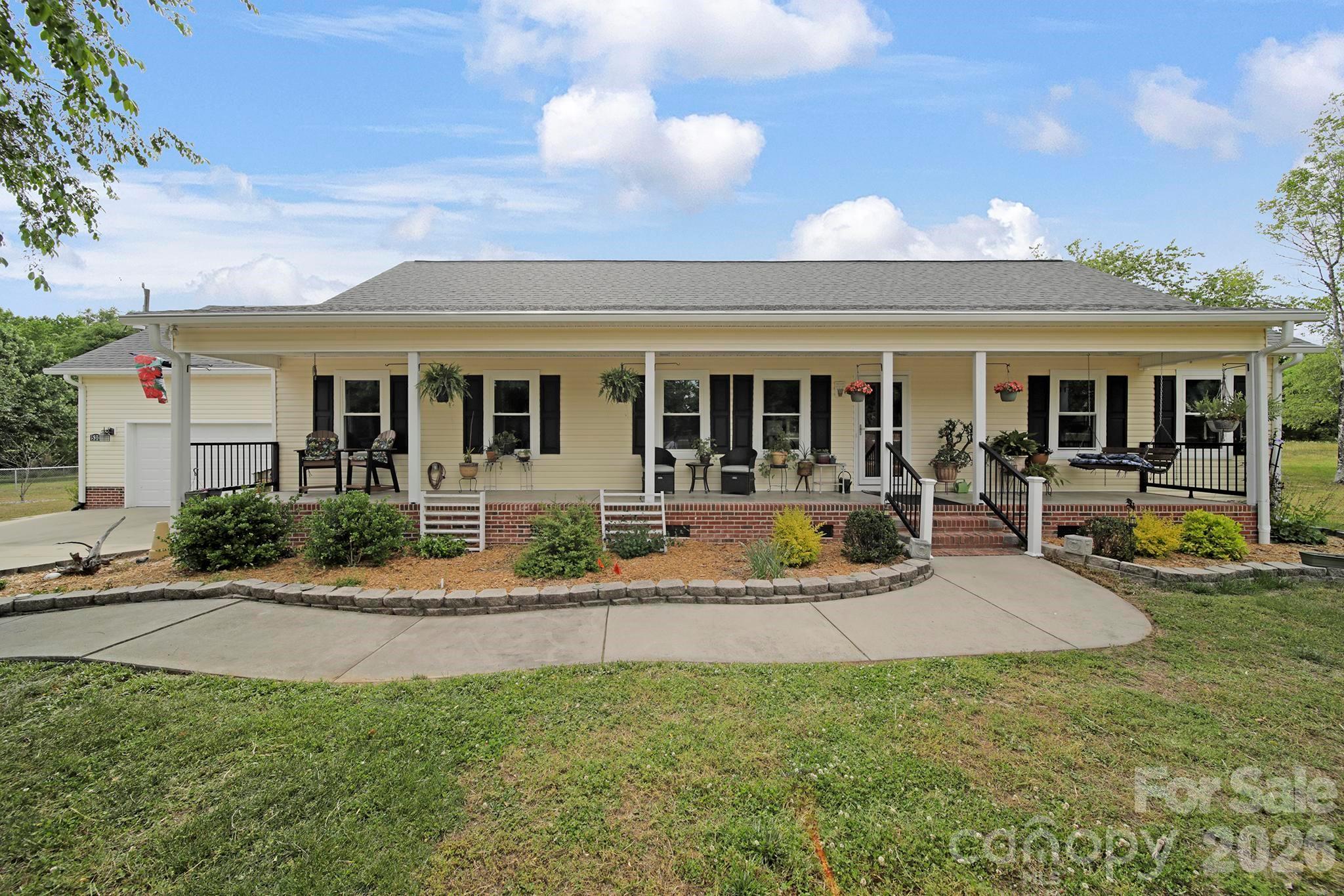 Welcome to 530 Calabash Road where you can spread out and breathe a little deeper.  This expansive home on over an acre offers a unique blend of space and utility.  Enjoy the peaceful country setting, complete with beautiful gardens and trees, and a sprawling outdoor entertaining area...all just a short drive to downtown Clover, Lake Wylie, Charlotte, Rock Hill, etc.  Inside, you’ll find a spacious place & well-maintained layout with 3 bedrooms and 2 full baths on the main level, 2 bonus rooms upstairs (1 with a full bath), a vaulted ceiling living room with fireplace flowing into the large, functional kitchen, and a huge dining room or sunroom ready for everyday living and entertaining.  When you step outside, the possibilities really start to open up.  You'll love the large deck and additional paved, ground-level patio with fireplace and freestanding bar...you'll also see the immediate possibility for a pool with the perfect space just waiting!  Just beyond all of that is a garden as you approach the large detached workshop/studio featuring 9 ft ceilings, running water, and TONS of built in storage cabinets and shelves.  You'll have room galore for hobbies, equipment, a small homestead setup, etc.  With no city taxes and a location that keeps you connected while still offering room to spread out, this property is ideal for someone looking for comfort, functionality, and long-term potential. 
*The installation of fiber optic utility lines along Calabash Rd. is underway!  Enjoy everything this serene property has to offer as well as improved high-speed internet access for the home!*
