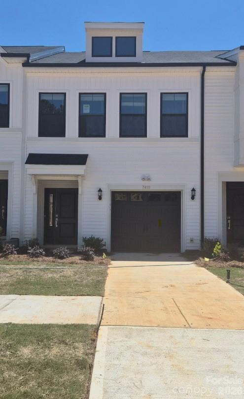 This end unit two-story townhome includes three bedrooms and two-and-one-half bathrooms. Immediately inside the entrance, a hallway leads past the staircase and half bathroom and into the open concept great room with a fireplace, eat-in, kitchen, and patio. Upstairs, the primary suite features a walk-in closet, a tray ceiling, and dual vanities. A laundry closet is located just outside of the primary suite for ultimate convenience. Two secondary bedrooms and one full bathroom are also located upstairs. A one-car garage along with a bench and cubbies complete this floor plan. Additional windows on both levels ensure abundant natural light in the home.