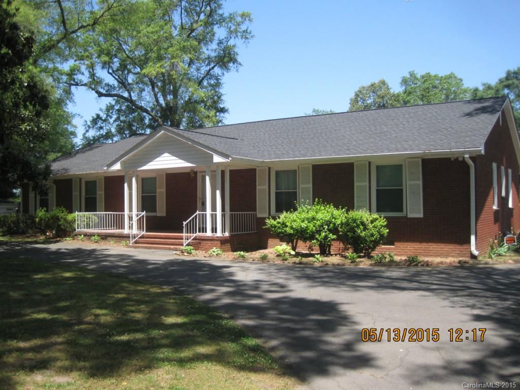 Large 4 bedroom 2 bath ranch style home in Fort Mill, SC close to Carowinds! Beautiful Hardwood floors through out. Fully equipped kitchen w/ tons of cabinet space. Formal living & dining rooms. Spacious family room w/ wood burning fireplace. 4 spacious bedrooms w/ ample closet space & 2 full baths.  Small basement area for additional storage. Rear screened in porch and large 2 car carport.