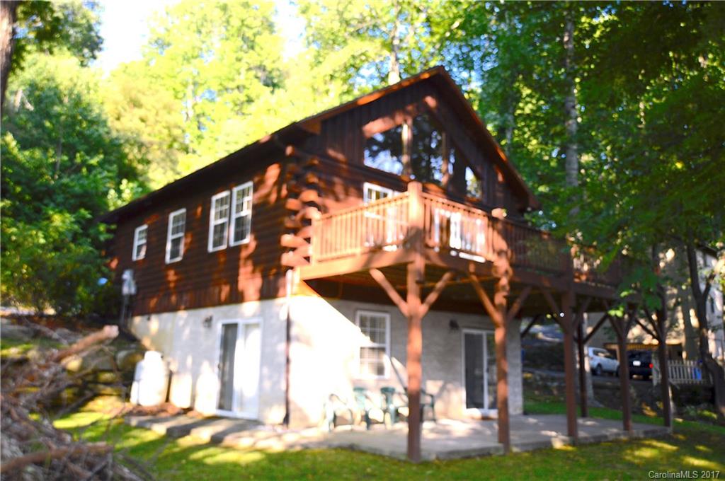 Log Cabin with easy access and some Mountain Views... Beautiful wood work throughout with large Vaulted windows to let in the light... accented by stone fireplace... open kitchen design with tile counters.. easy to love this house.. downstairs is full of possibilities - large oversized bedroom could be sleeping area and den/media area... access to the patio with large accent Boulders and wired for a Hot Tub... add a fire pit and it is ready for entertaining... paved access- Cable internet avail.