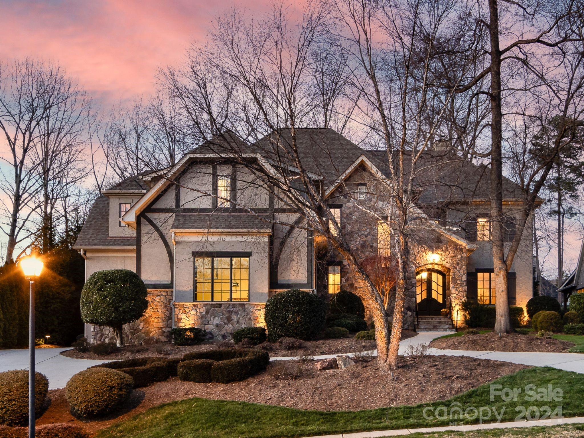 Nestled in a coveted location in Matthews on almost a half acre with a pool! This luxurious & functional custom home w/ heavy millwork, 10 ft. ceilings, plantation shutters, & wood floors boasts 3 separate living spaces on the main plus a screened porch. The kitchen w/ a gorgeous vent hood, gas range, apron sink, bev. fridge, island w/ prep sink & lovely dining area opens to a great room w/ coffered ceiling & floor-to-ceiling stone fireplace, while a stunning drop zone & home office provide ideal spaces for organization. The upper floor features a primary suite w/ dual WI closets, soaking tub & sep. shower plus two bedrooms w/ a Jack n Jill bath, a bedroom w/ en suite bath, a flex room, a bonus/5th bed. w/ a full bath, gym space, walk-in attic & custom closets. A terrace w/ a built-in grill, a built-in fire pit area, a hot tub & an 8 ft. deep PebbleTec saltwater pool w/ waterfall offer an outdoor oasis in the fenced yard! Circular drive, 3 car garage & zoned for sought-after schools!