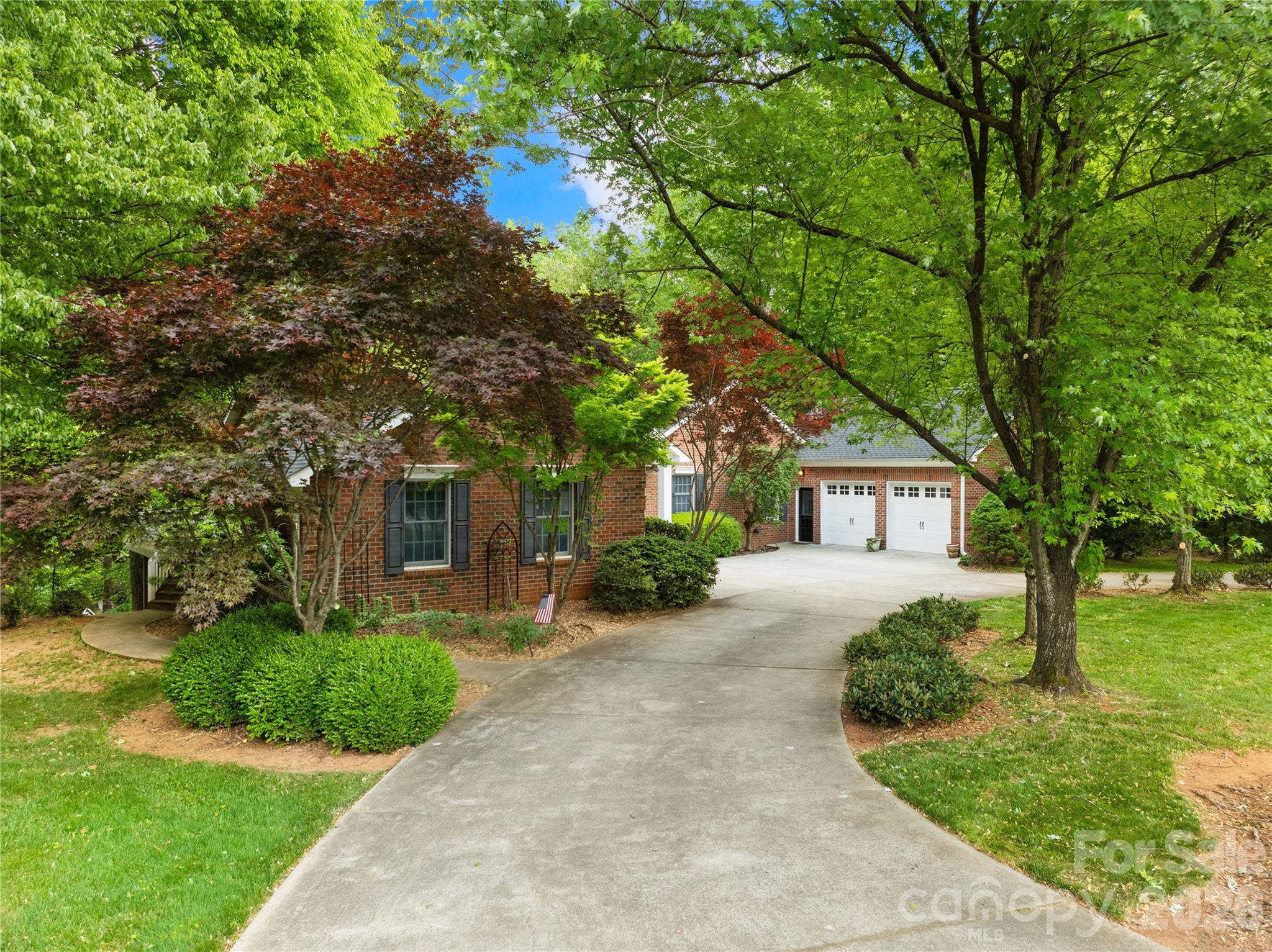 Welcome to one of North Carolina’s best-kept secrets—Statesville Country Club, perfectly positioned near I-77 and I-40 taking you anywhere you need to go! This established community is known for its stately homes, pristine golf course, and exceptional amenities, offering a lifestyle that makes it hard to ever want to leave.

This 4-bedroom, 6-bath brick ranch with a full basement delivers the ideal blend of main-level living and expansive space to grow, entertain, and unwind. From the moment you arrive, the circular drive and inviting curb appeal set the tone. Step inside to find a home freshly painted from top to bottom, featuring beautiful hardwood floors and an abundance of natural light throughout.

The main level offers a thoughtful layout with a traditional living room anchored by a fireplace, a spacious kitchen, formal dining areas, and a large family room tucked away from the bedrooms—perfect for hosting without sacrificing privacy. On the opposite side, you’ll find a secondary bedroom and full bath, along with a generous primary suite that opens directly onto a full-length back deck overlooking a serene, park-like backyard.

The fully finished basement is an entertainer’s dream, complete with additional bedrooms, multiple living spaces, and a wet bar—ideal for gatherings, guests, or multi-generational living.

Optional membership opportunities at Statesville Country Club provide access to a range of amenities, or simply enjoy the beauty and prestige of the neighborhood without joining. This is more than a home—it’s a lifestyle.living in a stunning neighborhood!