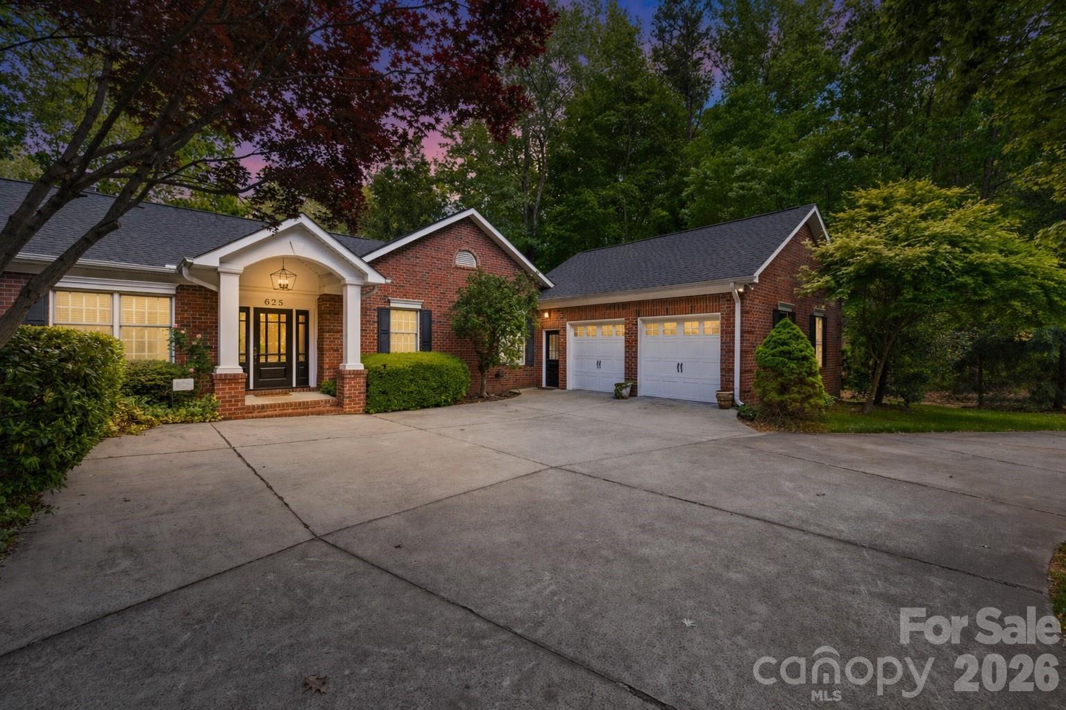 Welcome to one of North Carolina’s best-kept secrets—Statesville Country Club, perfectly positioned near I-77 and I-40 taking you anywhere you need to go! This established community is known for its stately homes, pristine golf course, and exceptional amenities, offering a lifestyle that makes it hard to ever want to leave.

This 4-bedroom, 6-bath brick ranch with a full basement delivers the ideal blend of main-level living and expansive space to grow, entertain, and unwind. From the moment you arrive, the circular drive and inviting curb appeal set the tone. Step inside to find a home freshly painted from top to bottom, featuring beautiful hardwood floors and an abundance of natural light throughout.

The main level offers a thoughtful layout with a traditional living room anchored by a fireplace, a spacious kitchen, formal dining areas, and a large family room tucked away from the bedrooms—perfect for hosting without sacrificing privacy. On the opposite side, you’ll find a secondary bedroom and full bath, along with a generous primary suite that opens directly onto a full-length back deck overlooking a serene, park-like backyard.

The fully finished basement is an entertainer’s dream, complete with additional bedrooms, multiple living spaces, and a wet bar—ideal for gatherings, guests, or multi-generational living.

Optional membership opportunities at Statesville Country Club provide access to a range of amenities, or simply enjoy the beauty and prestige of the neighborhood without joining. This is more than a home—it’s a lifestyle.living in a stunning neighborhood!