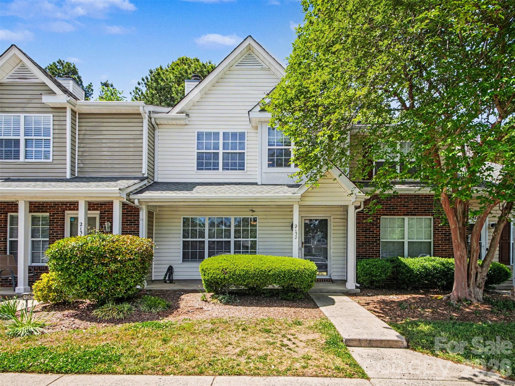 Welcome to 2132 Preakness Court with an inviting covered front porch!  This beautifully maintained and move-in ready home offers a fantastic opportunity for an investor or a buyer seeking low-maintenance living in a convenient location. The spacious kitchen features a large island, perfect for meal prep, entertaining, and extra storage. The primary suite offers a vaulted ceiling, a generous walk-in closet, and a private en-suite bath, creating a comfortable retreat. Interior upgrades include bamboo hardwood flooring in the dining and family rooms, tile flooring in select areas, updated lighting in the dining area and upstairs bathrooms, and a cozy gas-vented fireplace. Upstairs includes plush carpeting with upgraded padding throughout the bedrooms, hallway, and staircase. Step outside to a nicely sized patio and enjoy a tree-lined backyard that provides both privacy and shade. Community amenities include a pool, walking trails, dog park, and playground—perfect for enjoying an active lifestyle. Ideally located near shopping, dining, Carowinds, Rivergate, and with easy access to I-77 for an easy commute. Water heater (2019) and HVAC (2015). Refrigerator, washer/dryer convey. HOA dues include water, trash, and sewer, adding extra value and convenience.