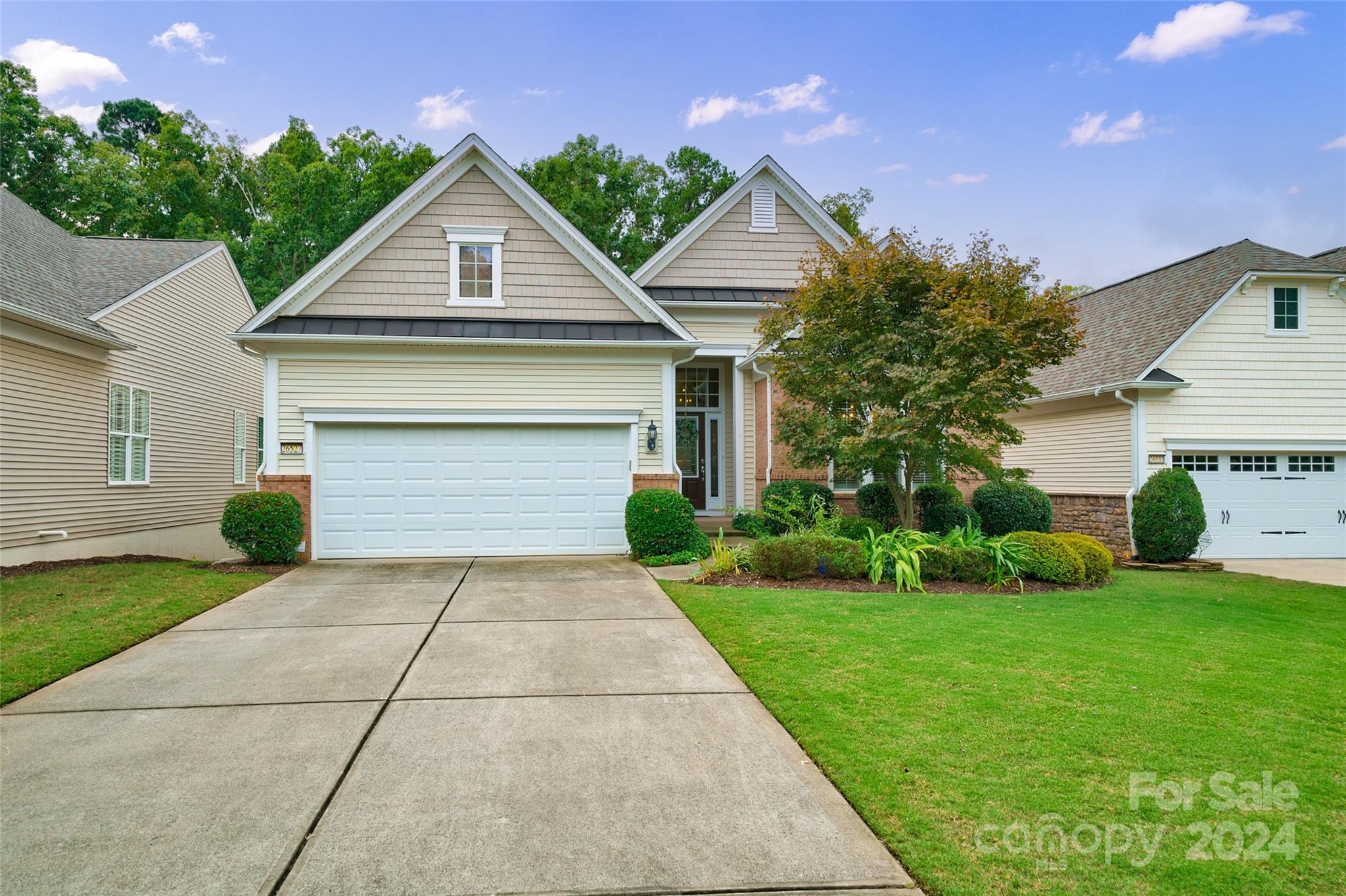 If you are looking for that perfect home in a 55+ community w/an active-adult lifestyle look no further.  Nestled at the end of a quiet cul-de-sac this waterfront home offers a tranquil & serene backyard which can be enjoyed whether you are sitting in the spacious sunroom located at the back of the home or on the deck or patio.  Inside, the home has an inviting open floor plan with hardwoods on the main level. Kitchen has antique white cabinets, center island, granite ctops, ss appliances, gas oven.  There is a flex space on the main level that can be used as an office or a den.  The primary and a secondary bed together with 2 full baths are on this level.  Downstairs is the large finished basement with tons of storage.  Here you will also find the 3rd bed & full bath. The remaining rooms offer endless possibilities - craft room, movie room, office, gym.  This community has so much to offer - golf course, clubhouse, fitness center, pools, tennis, walking trails, and more. Don't wait!