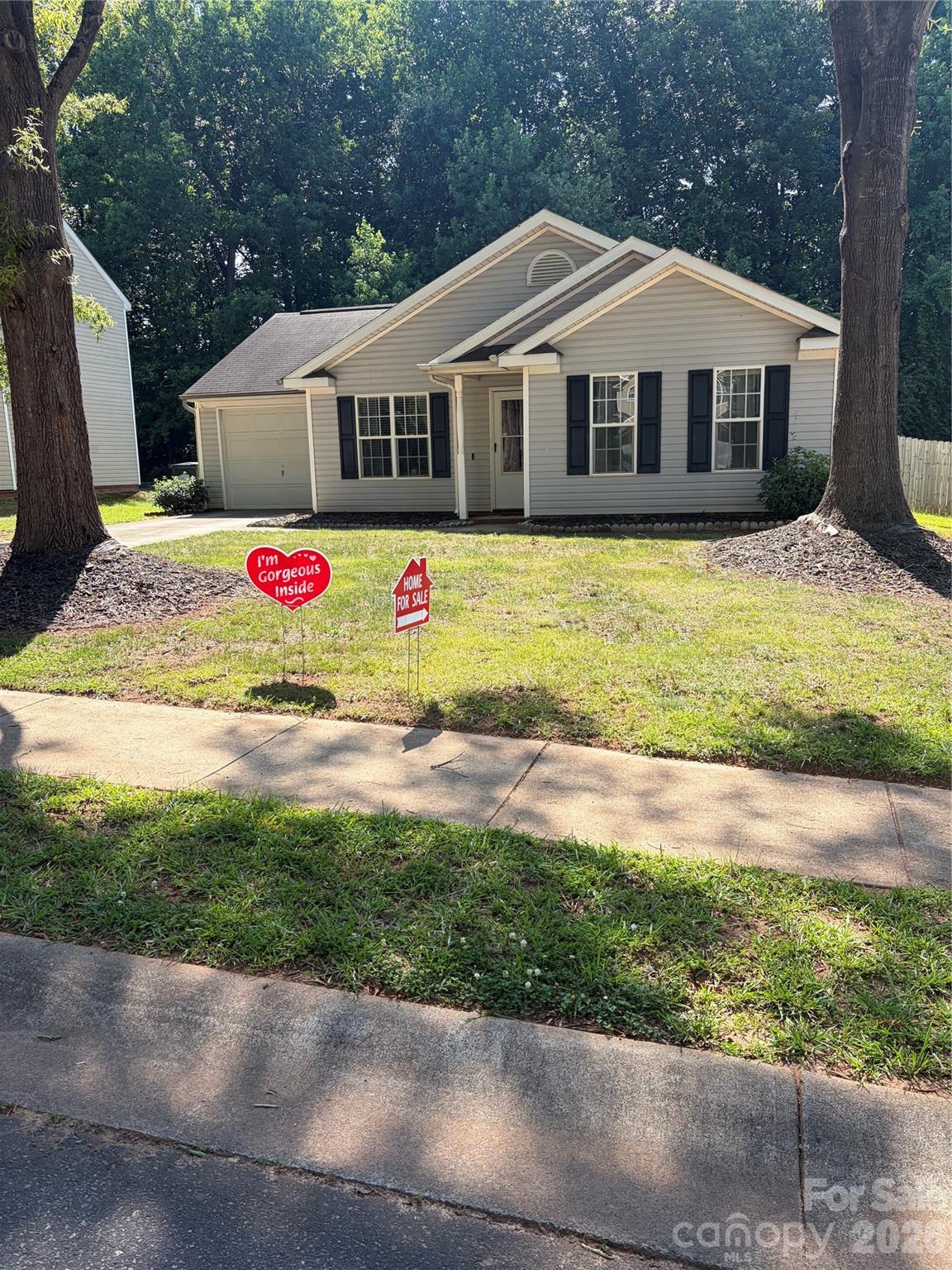 We are delighted to present an exceptional single family ranch style residence, meticulously crafted to offer sophisticated comfort and timeless style. This exquisite home offers 3 bedrooms and two full bathrooms.  This MOVE IN READY home displays recent significant updates, including a NEW HVAC system in 2019 and a NEW HOT WATER HEATER in 2024. This provides a sense of security. The flooring throughout the kitchen area boosts NEW Luxury Vinyl Planks.  The master bedroom is spacious, and the home showcases vaulted ceilings
Ideally positioned in a lovely community. The property is celebrated for its tranquil ambiance and advantageous proximity to a wealth of local amenities including I485 and UNCC. The neighborhood has a large swimming pool, clubhouse and playground. The Home Association dues are very reasonable, approximately $41 per month.
upon entering the residence, you will experience an interior design that evokes serenity.  The living room features a charming Gas fireplace surrounded by elegant Marble, a warm inviting focal point. The kitchen features stunning  Newly installed GRANITE Countertops with backsplash . The Granite center island is great for food preparation, additional seating and added visual appeal. This home has a designated mud room and laundry room. 
The residence is situated on a level lot that extends to a spacious fenced backyard. The back yard offers serenity and privacy.   This is a MUST SEE HOME