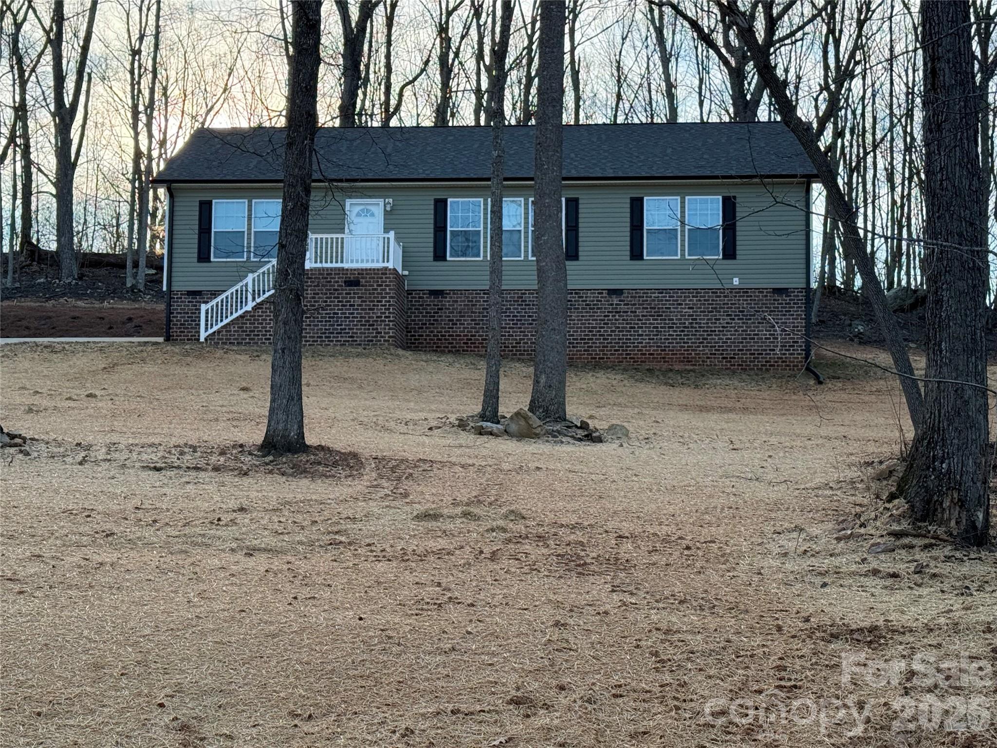 Beautiful 3 bedroom/2 bath home with ope floor plan.  Large Master Bedroom and Master Bath, Spacious Kitchen, cabinets galore with eating area, very large family room.  The location is convenient to anything you can think of. Only minutes form the intersection of Hwy 73 and Hwy 16.

YARD HAS BEEN POWER RAKED SEEDED AND STRAWED AND A TURNAROUND WAS ADDED.  CECK OUT PICS.
