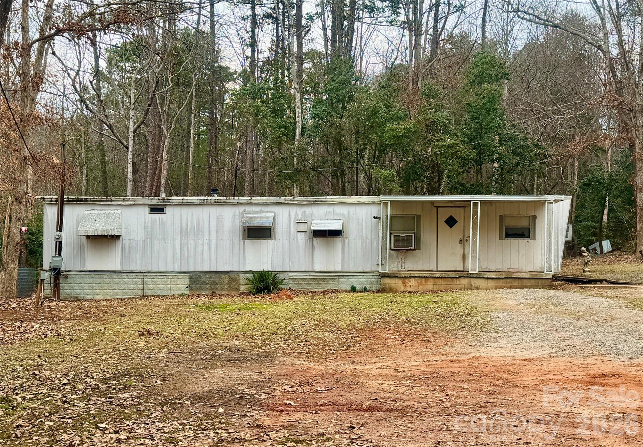 Affordable 2 bedroom 1 bathroom single wide on over half an acre in Northeast Hickory. Conveniently located not far from Springs Rd shopping and dining or Downtown Hickory. With some renovations this could be a great investor home to rent out or has the potential for someone to make it their primary residence at a low price point. Cash buyers or Seller Financing.