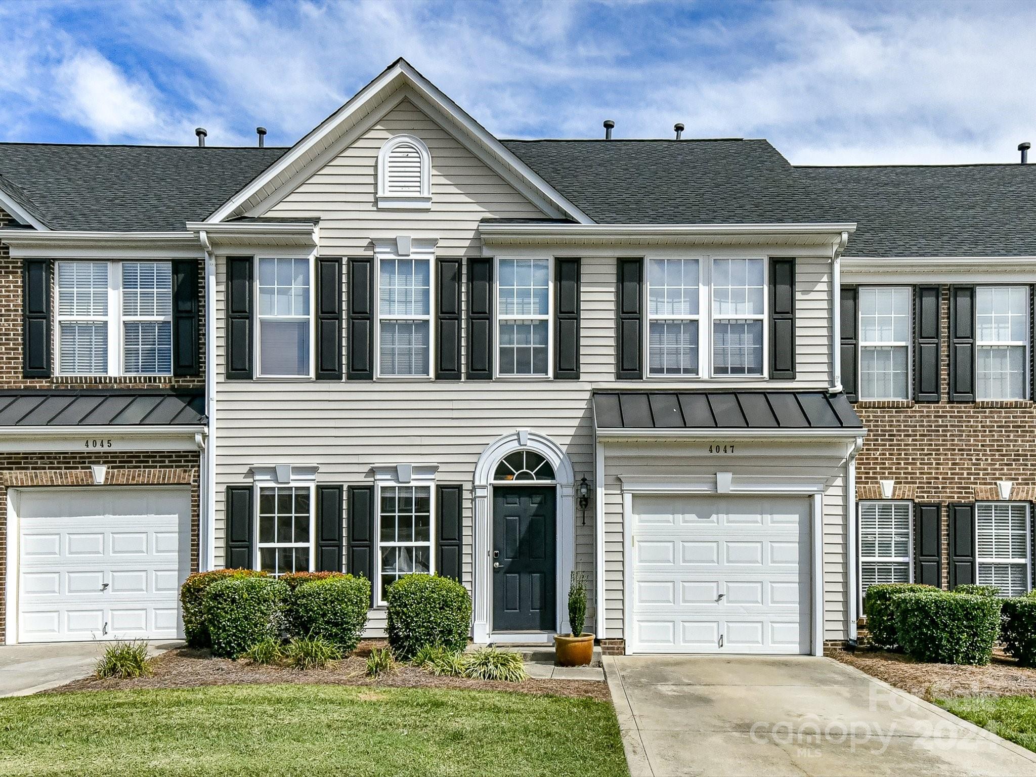 Fabulous 3 BR /2.5 bath townhome w/1 CAR GARAGE in Indian Trail backs up to private common area. Convenient to shopping, restaurants & theater you will simply love living in Holly Park with a community pond at the center of the community. This amazing home has just been painted a beautiful neutral color and is move-in ready. The open floor plan features a fantastic SUNROOM overlooking fenced backyard. Large family room perfect for entertaining, connects to Breakfast area & kitchen w/additional bar seating & food pantry. Formal Dining Room off of the main foyer area. Spacious primary suite has TWO WALK-IN CLOSETS w/shelf systems, trey ceiling, garden tub & separate shower. Roomy secondary bedrooms are sure to please! Step out onto the patio to relax and enjoy the private backyard with small pond underneath trellis. Refrigerator, washer & dryer are included.  HOA dues include water/sewer & lawn outside of fence. Water Heater replaced 2024. Furnace replaced 2021. $7000 Flooring Allowance