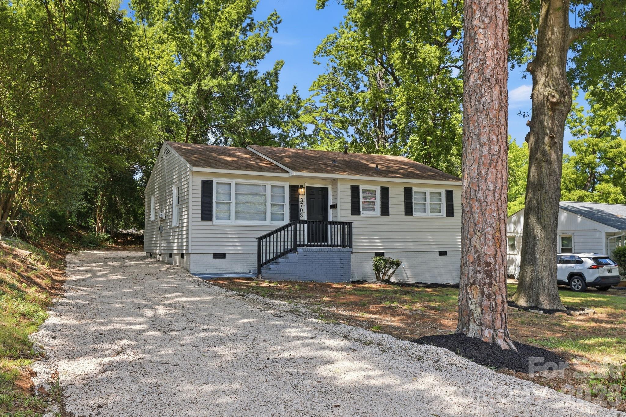 *THIS HOME QUALIFIES FOR 100% FINANCING, NO PMI & $10,000 IN LENDER ASSISTANCE FOR CLOSING COSTS, RATE BUY DOWN & LOAN AMOUNT REDUCTION!!* DON'T MISS THIS ONE!!! Picturesque 3 bed 1 bath single story home in the heart of Charlotte in the Westerly Hills/West View area. Driving by, the arresting curb appeal from a full exterior paint overhaul, fresh landscaping & improved driveway already make your new home one of the nicest on the block. Stepping inside, new stylish, durable & low-maintenance LVP, a full, fresh interior paint overhaul of all walls, trim, doors & windows, new blinds & new six-panel doors throughout have reinvigorated your home for your move-in, while still preserving the opportunity for you to add your own personal touches & finishes. The upgraded kitchen is primed & ready for all of your culinary needs, already fitted w/ new granite counters, shaker-style cabinetry, SS appliances (includes new dishwasher, electric range & microwave), subway tile backsplash & SS dual deep sink. Three expansive bedrooms provide a generous amount of living space for any residents or guests & are each only a few steps away from the updated full bath (highlights include new vanity, LVP flooring & tile surround for tub/shower combo), providing the utmost convenience & smoothest living experience for all within your home. Stepping outside, a large 0.22-acre lot provides tons of room & limitless potential to fulfill your plans for hosting all summer long. In reference to the greater Charlotte community, being only a few miles from Uptown Charlotte & having easy access to I-85 and I-77 makes commuting to all of your favorite grocery, dining, retail, entertainment & service-related businesses the easiest it's ever been. Food Lion, ALDI, & Walmart are within a 5-10 min. drive for grocery stores; South End, Camp North End, Uptown & the Charlotte International Airport are only within 10-15 mins. If you're looking to begin or want to maintain an active lifestyle, Westerly Hills & Revolution Park are only a few mins. away & together provide walking trails, playgrounds, basketball courts, picnic shelters, athletic facilities, open green spaces & a public golf course (Revolution Park); the renowned & beloved Whitewater Center is also only a short 15-20 mins. away. Finally, w/ Atrium Health Carolinas Medical Center, Atrium Healthy Mercy & Novant Healthy Presbyterian Medical Center a quick 10-15 mins. out, you have immediate access to some of THE BEST medical care in all of Charlotte in case of emergencies. An updated property at an extremely affordable price in the heart of Charlotte, you have all you need RIGHT HERE at 3708 Carlyle Dr!!