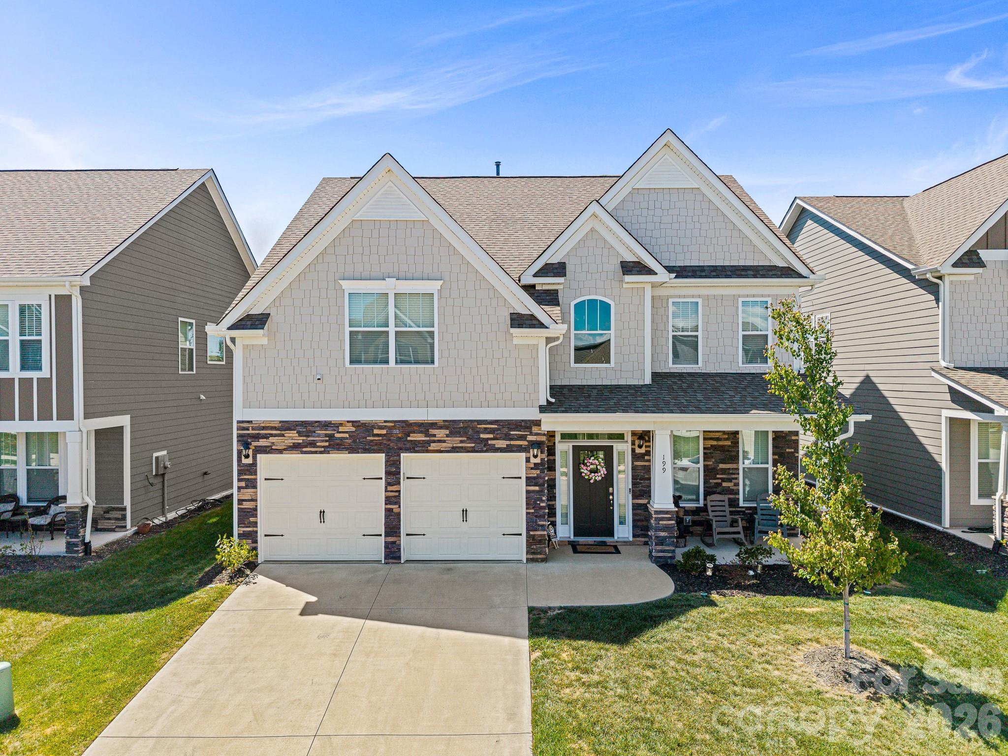 Welcome to one of the most exceptional homes in Cantrell Hills—a stunning 2023 build offering a rare combination of luxury finishes, privacy, breathtaking Blue Ridge Mountain views, and one of the best values currently available in the community. Priced to sell and offering an additional $5,000 seller credit at closing, this is a rare opportunity to secure one of Cantrell Hills’ premier view lots at an exceptional price point.
The highly sought-after Fleetwood plan makes an unforgettable first impression with a grand two-story foyer, elegant wrought-iron staircase, detailed wainscoting, and refined crown molding throughout. Natural light pours in, drawing your eye straight to the expansive, unobstructed views behind the home—an increasingly rare find in this community. With no homes directly behind, you’ll enjoy a level of privacy and scenery that only a select few properties here can offer.
The open-concept living space is designed for both comfort and entertaining. A warm and inviting family room with a gas-log fireplace flows seamlessly into a beautifully appointed kitchen featuring granite countertops, tile backsplash, stainless steel appliances, and a spacious pantry. Step outside to unwind in your private jacuzzi while taking in unforgettable sunsets over the mountains—this is everyday luxury.
A main-level guest bedroom with a full bath provides ideal flexibility for visitors or multi-generational living. Upstairs, the owner’s suite is a true retreat with double-door entry, tray ceiling, and a spa-like bath. Two additional bedrooms, a full bath, and a conveniently located laundry room complete the upper level.
Additional highlights include a furnished bedroom ready for immediate use, along with washer and dryer that convey with the home.
Perfectly positioned just minutes from shopping, dining, and downtown Hendersonville, with quick access to Asheville Regional Airport. Community amenities include a pool, clubhouse, and dog park.
Rare, refined, and move-in ready—this is not just another home in Cantrell Hills, but one of the community’s standout properties.