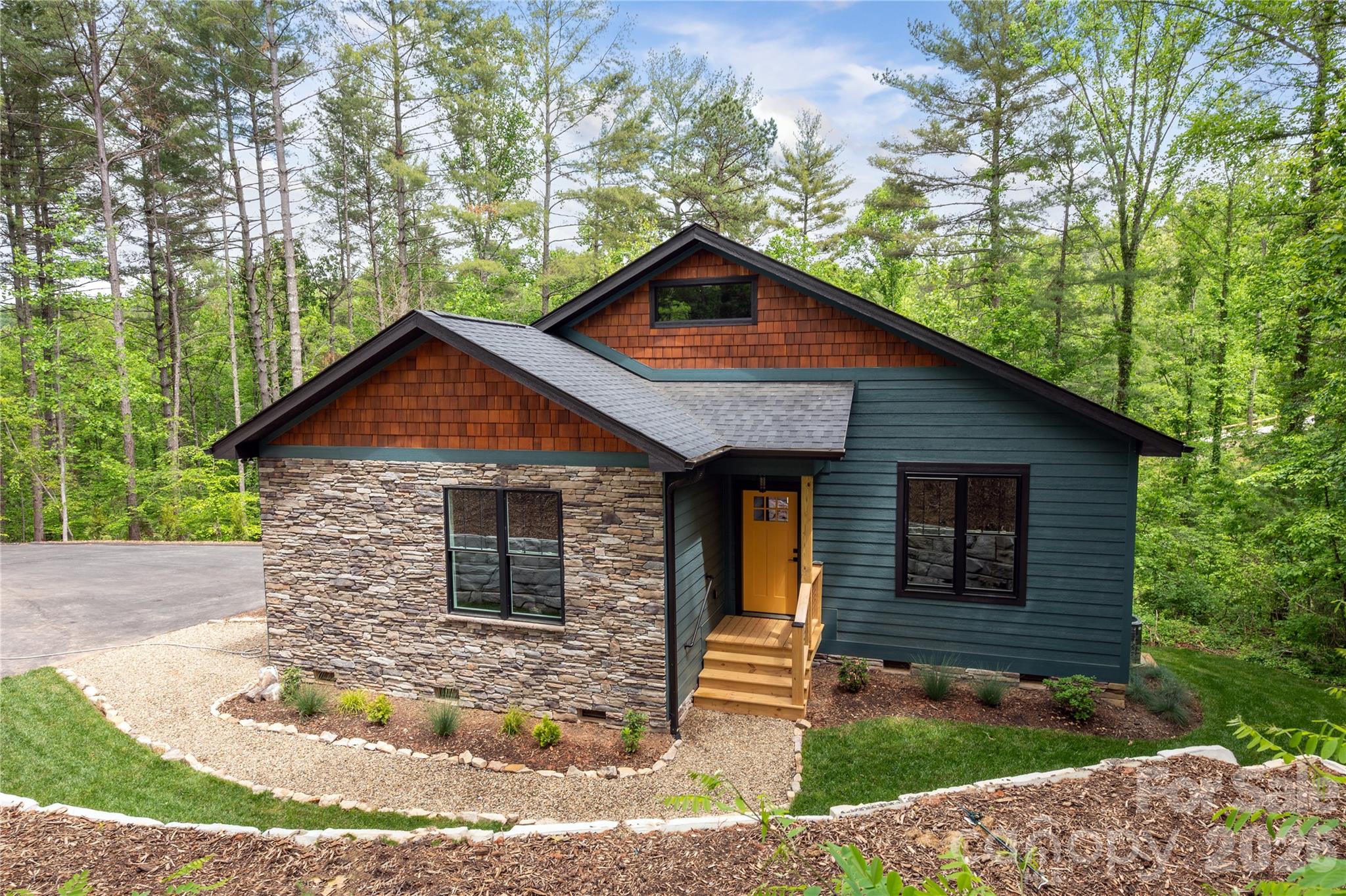 Tucked away on a private 0.89-acre setting in Weaverville, this beautiful new-construction home blends modern comfort with thoughtful design and abundant natural light throughout. Step inside to 9-foot ceilings and finished-in-place hardwood floors that create a bright, open feel across the main level. The well-appointed kitchen features stainless steel appliances, under-cabinet lighting, a stylish tile backsplash, and a spacious walk-in pantry, making it both functional and inviting for everyday living and entertaining. The main level offers the convenience of two bedroom suites, each with custom walk-in closets, providing comfort and privacy. A main-level laundry room adds everyday ease. Just off the living space, enjoy the outdoors from the large, full-length rear deck, perfect for relaxing or entertaining while overlooking the peaceful surroundings. The walkout basement level features impressive 10-foot ceilings, a large recreation room, an additional bedroom, and a full bathroom, providing flexible space for guests, hobbies, or multi-generational living. Upstairs, over 500 SF of unfinished space offers excellent potential to create additional bedrooms, a home office, or bonus living area. With its private setting, quality finishes, and room to expand, this home offers the perfect blend of new construction and future possibilities.