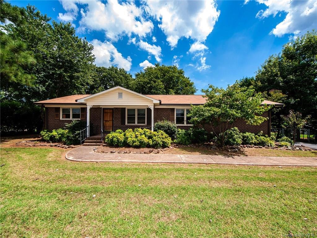 Ranch style home on level lot with detached garage along with an attached carport.  The yard is beautiful and reaady for your family!  This home has 3 bedroom and 2 full bath rooms.  The appliances remain.  The laminate was recently installed.  This house is spic and span and move in ready.  It is on a large .65 acre lot.  You will love the built ins on each side of the fireplace in the family room.  Sunset views from your front porch swing.  This home will go fast!  Schedule your viewing now!