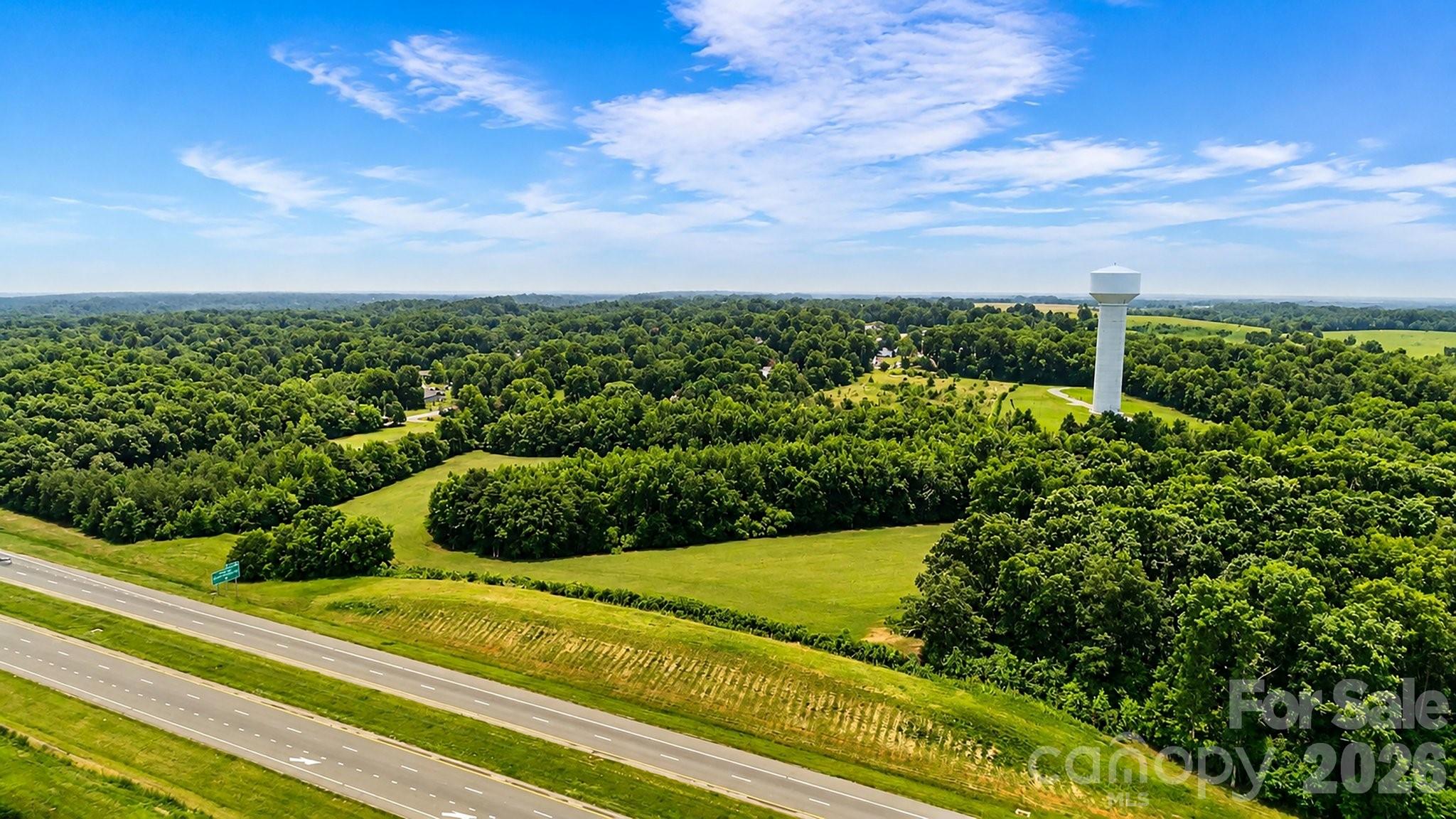 This beautiful parcel of land spanning 8.5(+/-) acres is a rare find in Union County. The property boasts a picturesque setting in a rural area, yet it is conveniently close to major highways, shopping centers, and other amenities. This site has easy access to major transportation routes, making it an ideal location for a variety of uses. This land has been left undeveloped, making it an ideal canvas for those seeking to build their dream home or farm. A true one-of-a-kind location.