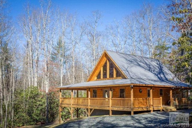 If you want a Mountain getaway, this is it!!! Own it, Rent it for income or just live the Mountain lifestyle. This home is positioned on 2.50 acres and within a half-mile of the Blue Ridge Parkway and the Pisgah National Forest. The Linville River is approximately 1200 feet straight-line distance from the home. Great fishing and hunting opportunities surround this property. Also, you are approximately 15 minutes to the ski lodges and shopping.  Two bedrooms and two and a half baths. Large master bedroom and bath with ceramic tile flooring and custom built tile shower. Hardwood flooring throughout the home. The kitchen has custom built wormy oak cabinets with granite tops.  The basement is unfinished but is plumbed for an additional bathroom. High vaulted ceiling with huge glass windows that face the beautiful Blue Ridge Mountains.  Also, the 824 square foot wrap around porch puts the finishing touch on the home. Act fast