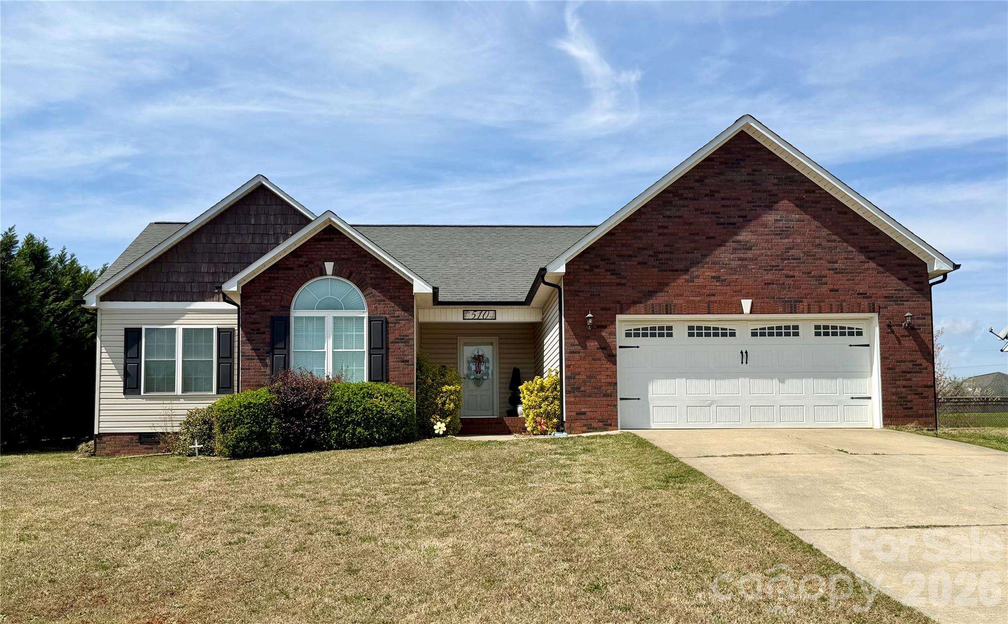 Welcome home to this charming 3 bedroom, 2 bath ranch style home offering comfortable one-level living. This property features a spacious open layout living area with vaulted ceilings for added character, real wood floors, and custom wood shutter window treatments in every room. The kitchen offers Stainless Steel Appliances, and French Door Refrigerator included. The primary suite includes a walk-in closet, a private bathroom with garden tub and stand alone shower for added convenience. Enjoy outdoor living with a sizable yard and added trees for privacy. This property is ideally located, just minutes from dining and local amenities. You don't want to miss this!