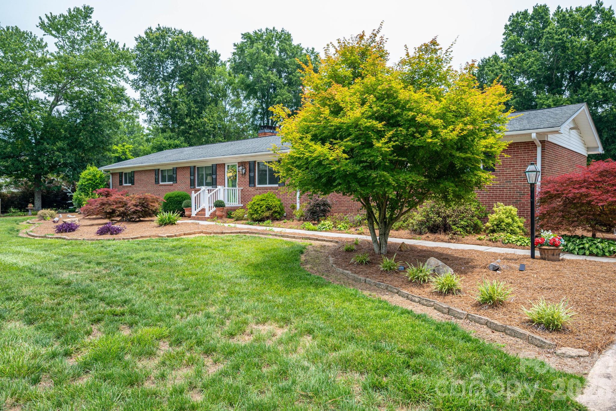 A true gem with backyard oasis sure to produce lasting memories!  There is so much to love at 403 W. Old Post Road in Cherryville, NC.   The classic brick home, the space, the updated bathrooms, the salt water in-ground pool, the numerous outbuildings/workshops, the flowering plants and trees, the privacy of the 1.38 acre lot, room for a garden, boat, camper and all your toys.  All of this in a convenient location just off of Highway 274.   If you are looking for a 3BR/2BA home, this is a must see!  There is so much to see, love and appreciate.