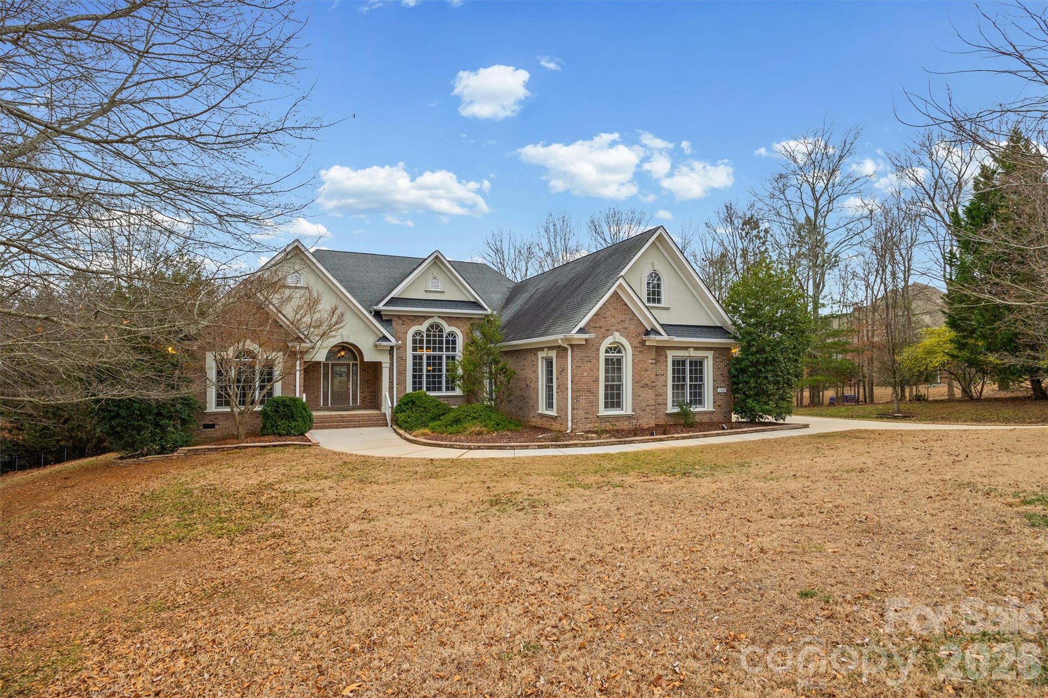 Welcome to your private oasis — complete with a sparkling pool, hot tub, and lush landscaping. This beautifully maintained custom-built ranch, crafted by one of the area’s premier builders, is loaded with thoughtful upgrades.
Step into the expansive foyer, where soaring ceilings and gleaming hardwood floors create an immediate sense of space and elegance. Graceful archways and rounded corners add architectural character to this refined 3–4-bedroom, 3.5 bath home.
The great room showcases a raised-hearth fireplace flanked by custom built-ins — the perfect gathering space. The chef’s kitchen is ready for entertaining with granite countertops, center island, and double ovens.
You’ll love the spacious primary suite on the main level, featuring dual vanities, two custom walk-in closets, a private water closet, walk-in shower, and a relaxing soaking tub.
French doors lead to the deck overlooking the stunning pool, your own outdoor retreat for relaxing or entertaining.
Upstairs offers a large bonus room or fourth bedroom with a full bath — perfect for guests, a media room, or home office. Oversized 3 car garage
Enjoy low S Carolina taxes and the award-winning CSD School District.