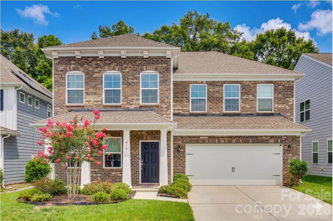 Discover Carolina living at its finest in this 5 bedroom residence, where elegance meets comfort. Highlighted by a main floor bedroom with en suite, a French door office, and an expansive open concept floor plan, this home offers seamless transitions between living and entertaining spaces. Gas, stainless steel appliances in the kitchen. Upstairs, a spacious loft compliments additional secondary bedrooms and an owner's suite, providing ample space for relaxation and privacy. A large upgraded patio with pergola and stone gas grill is a must see for this property. Located in award winning Fort Mill School district, this neighborhood's location is an absolute perk being close to Anne Springs Close Greenway, the YMCA Recreation Pickleball Courts and downtown Fort Mill, minutes from Ballantyne and highway access.