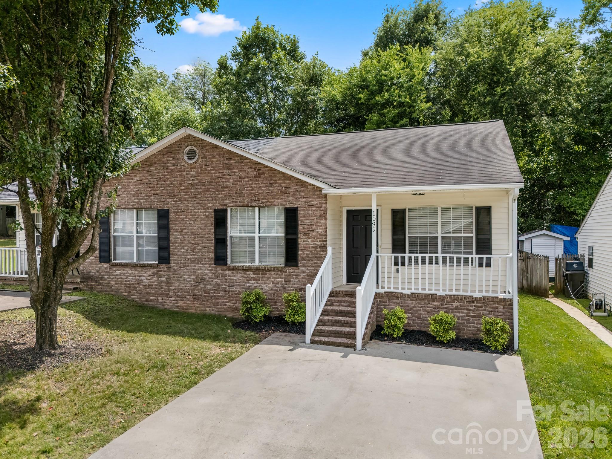 Welcome Home! This updated 2-bedroom, 2-bath home features an open-concept living and dining area with LVP flooring and modern light fixtures throughout. The kitchen includes granite countertops and stainless steel appliances, along with the refrigerator. The fenced backyard backs to a wooded area and offers space entertaining, or pets. With no HOA and a convenient Rock Hill location near parks, schools, shopping, dining, and access to I-77, this home combines updated finishes with everyday convenience. *Listing agent related to seller