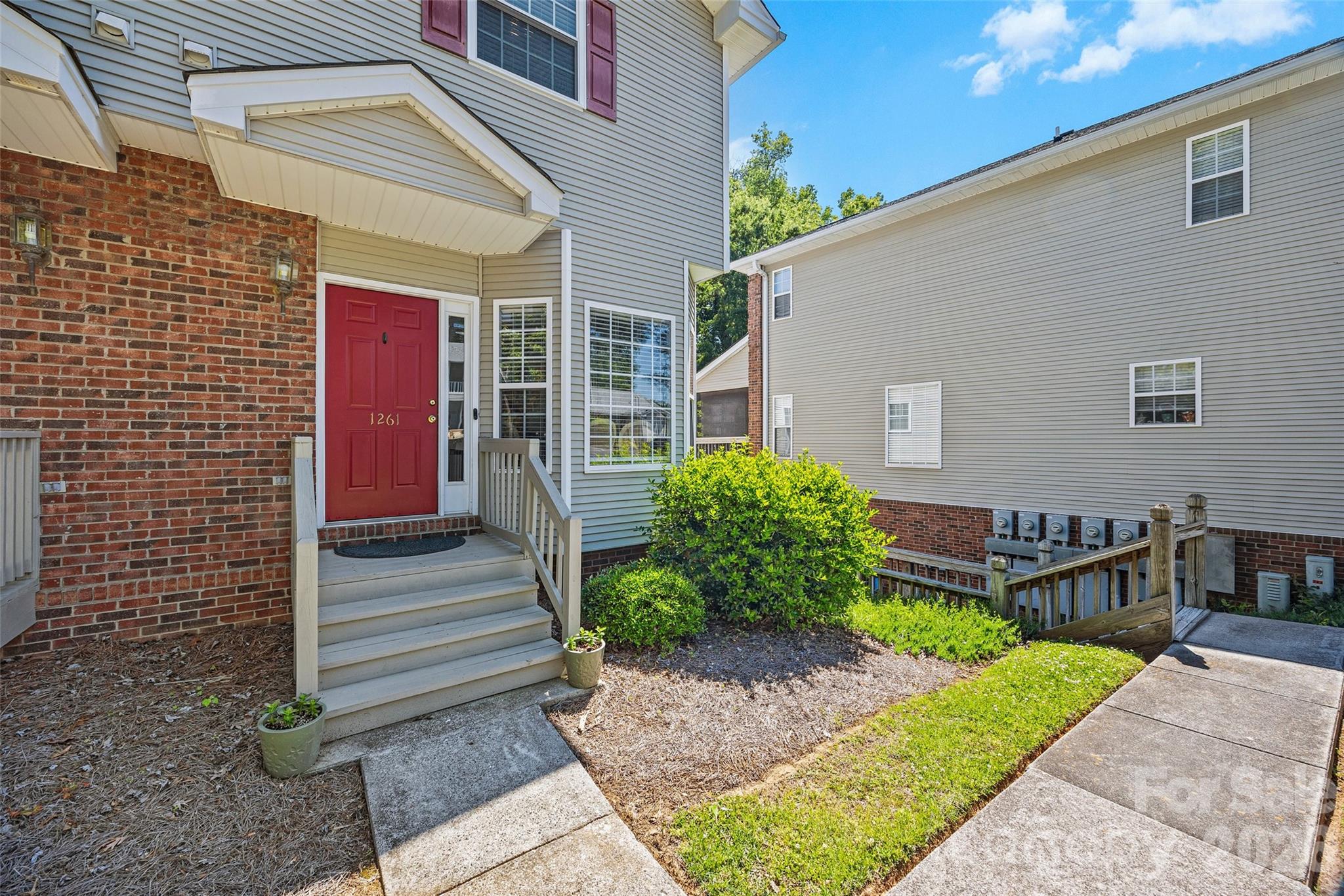 Rarely does a meticulously maintained end-unit hit the market in such a prime location, situated within walking distance of Fewell Park and Winthrop University. This three-story condominium offers a thoughtful layout full of surprises, beginning with a versatile bottom floor that features a one-car garage, ample storage, and a dedicated flex space. The main level serves as the heart of the home, boasting a sunlit kitchen and breakfast nook that flows into a living room anchored by a cozy gas fireplace and a breezy screened porch. Upstairs, two spacious bedrooms each enjoy private full baths and secondary laundry access for ultimate convenience. With stunning hardwoods throughout the top two floors, upgraded countertops, and mostly newer windows, every detail has been polished to perfection. This turn-key property—supported by a $200 monthly HOA that covers exterior maintenance, lawn care, and extermination—is ready to serve as a premier primary residence or a high-value addition to your investment portfolio.