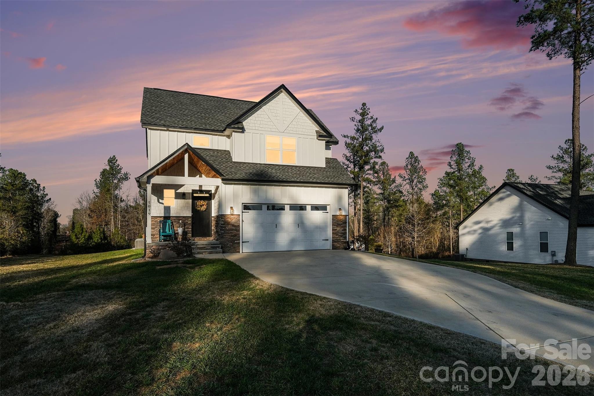 Welcome to 5019 Star Magnolia Ct, a beautifully built 2023 home that truly checks the boxes for space, style, and everyday comfort. With approximately 2,200 square feet, 3 bedrooms, and 3 full baths, this home offers the kind of layout that works just as well for quiet nights at home as it does for hosting friends and family.

The moment you walk in, the open floor plan pulls everything together. The living area flows effortlessly into the kitchen and dining space, creating a layout that feels open, bright, and connected. The kitchen is a standout with modern finishes, quartz countertops, stainless steel appliances, and plenty of cabinet and counter space, whether you’re cooking a quick breakfast or hosting a full holiday dinner.

The primary suite on the main level gives you privacy and convenience, while the additional bedrooms and baths provide flexibility for guests, home office space, or hobbies. Every room feels thoughtfully designed with comfort and function in mind.

Step outside and you’ll find a spacious deck overlooking the property, a perfect spot for grilling, relaxing, or enjoying the outdoors. Sitting on over 1.3 acres, the lot gives you room to breathe, play, and enjoy your space without feeling boxed in.

An attached two-car garage and generous driveway add to the everyday convenience, and the newer construction means you can move in with confidence knowing the home is built with today’s standards and materials.

Located in the Magnolia community, this home offers a peaceful setting while still being close to shopping, dining, and major routes connecting you to Clover, Lake Wylie, Fort Mill, Rock Hill, and Charlotte. It’s the kind of place that feels tucked away, yet keeps everything you need within easy reach.

If you’ve been waiting for a home that blends modern design, comfortable living, and a great location... this is it.