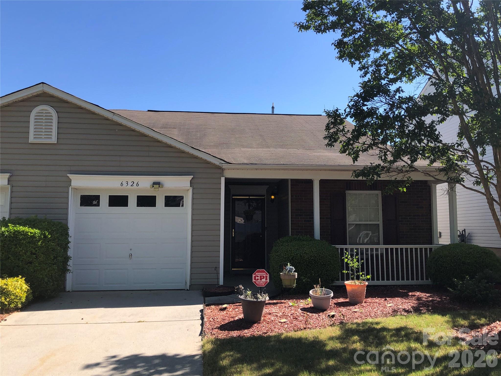 Beautifully maintained townhouse with nice open floor plan and all living space on the main level.  You'll really enjoy your covered front porch or back patio.  Single car attached garage with opener with MyQ capability that allows you to operate from your cell phone.  Kitchen has refrigerator, range, dishwasher, disposal, and microwave.  Main living area is open with a vaulted ceiling and a fireplace as well as easy access to the back patio.  Come see this gem with great access to I-485 as well.