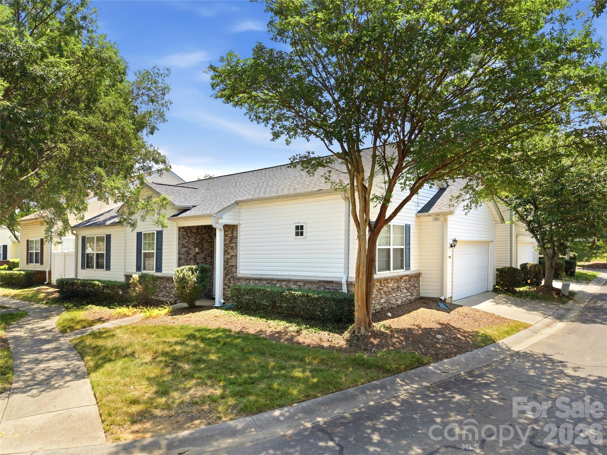 This beautiful single-story retreat is perfectly situated in Charlotte's highly desirable Highland Creek community. This home features 3-bedrooms, 2-bathrooms, with a bright and airy open-concept floor plan designed for effortless everyday living and entertaining. The main living area flows seamlessly into the kitchen and dining spaces, creating a warm, connected atmosphere centered around a cozy fireplace. Retreat to the comfortable primary suite, or utilize the two additional bedrooms for guests, a home office, or a growing family. Convenience is key with a main-level laundry room and a spacious 2-car garage providing plenty of storage.  Step outside and enjoy a peaceful, low-maintenance yard—but the real showstopper is the neighborhood itself. Highland Creek is legendary for its unparalleled, resort-level amenities. Spend your weekends enjoying multiple sparkling community pools, a state-of-the-art fitness center, tennis and pickleball courts, playgrounds, miles of scenic walking trails, and an 18-hole championship golf course and clubhouse right in your backyard! Don't miss the chance to claim your own slice of paradise in one of Charlotte’s premier master-planned communities.