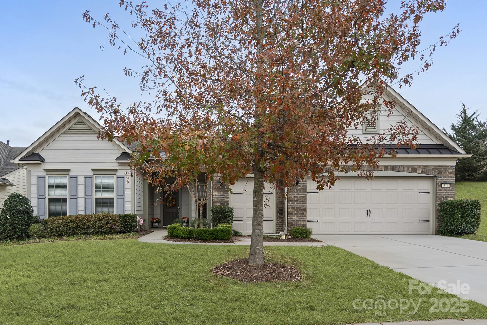 PRICE IMPROVEMENT - $750,000.00. 
The Dunwoody model - favorite of the Pinnacle collection.  Upgraded Kitchen - Pull-outs shelves and self close doors on the cabinets, KitchenAid stainless steel appliances (refrigerator included), double ovens, gas cooktop w/stainless hood, quartz countertops, island w/pendant lights & seating (bar stools included), separate bar area w/beverage refrigerator.  Adjoining Dining Area.  Great Room features a gas, stone fireplace w/raised hearth.  No carpet - easy care vinyl plank and tile throughout.  Window treatments included.  Dual primary suites, plus 2nd bedroom, plus office/flex spaces allow for a variety of room uses.  Primary bedroom has walk-in custom closet. Laundry room includes washer/dryer, laundry sink, tons of cabinets, and a folding area.  Screen porch (with retractable screen) and epoxy finished floor open to your private, fenced backyard.  2 car garage with additional golf cart garage and epoxy flooring complete the perfect home :).  Don't miss this one.
