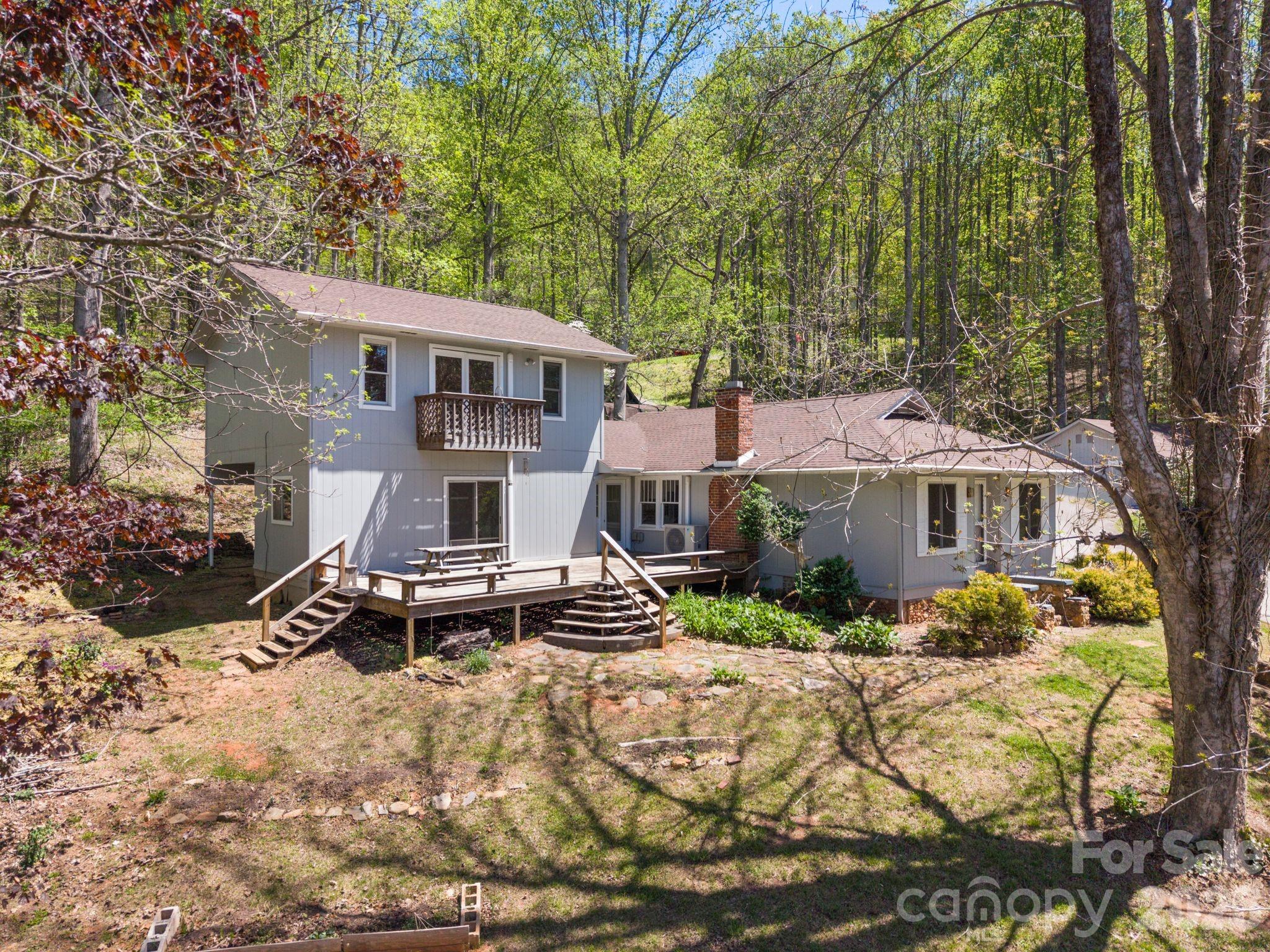 This is a turnkey rental portfolio, perfect for investors and landlords that desire a self contained property in the WNC mountains.  There are 8 separate individual residences.  Property is offered fully occupied.  Long term tenants tenants with active lease in place.  Two site built homes anchor the property.  A 4 bedroom main home and a 2 bedroom cottage.  This rental portfolio also features 6 separate manufactured homes of varying ages.  This property has a long operating history, complete with property management in place, with Rentahome Asheville.  Buyers can expect cash flow on day one, continuing to generate over $120k in yearly in rental income.  Tenants are all on updated leases, some are month to month.  All of these numbers and rental info is available upon request.  The units have been maintained and updated over the years.  An improvements list is available upon request.  The property consists of 3 separate parcels, amounting to 4.5 acres.  Utilities in place with 2 shared wells, 4 shared septics, and trash service in place for tenants.  Quiet, private, gorgeous views, and the tenants all keep to themselves and share the space collectively.  If you're seeking a well oiled machine, actively generating income, come take a look at this special property.  Property was appraised within the last 60 days. Also listed as multifamily rental portfolio MLS #4373451