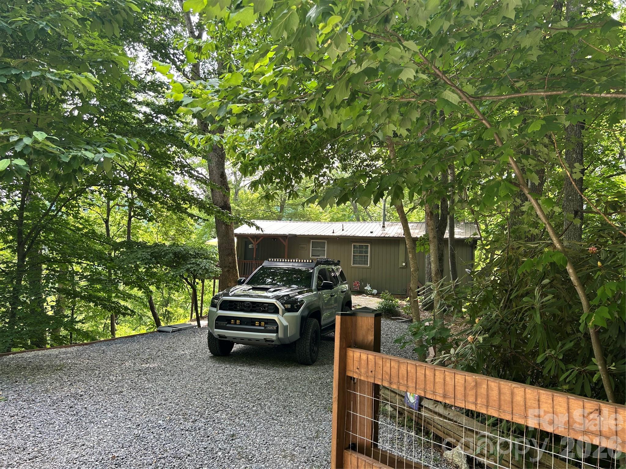 Beautiful cabin overlooking heavily wooded ridge. Enjoy the deck off the upper level or paver patio below, listening to the wind through the tree tops right in front of you. Open plan on the main level, and finished lower level make this the perfect spot to spend time with company while having the privacy of each bedroom on a different level. Bonnie Highlands is just off Morgan Hill Road and HWY 9, with easy access to Black Mountain (20 mins), Chimney Rock (20 mins) and Asheville (30 mins). The perfect getaway as your primary residence, second home, or short term rental. Heating and air via mini splits, plus wood burning stove and radiate heat on the lower level. Propane on-demand water heater. HOA functions only for road maintenance. Listing includes adjacent parcel 0626-21-2751-00000 in the total acreage