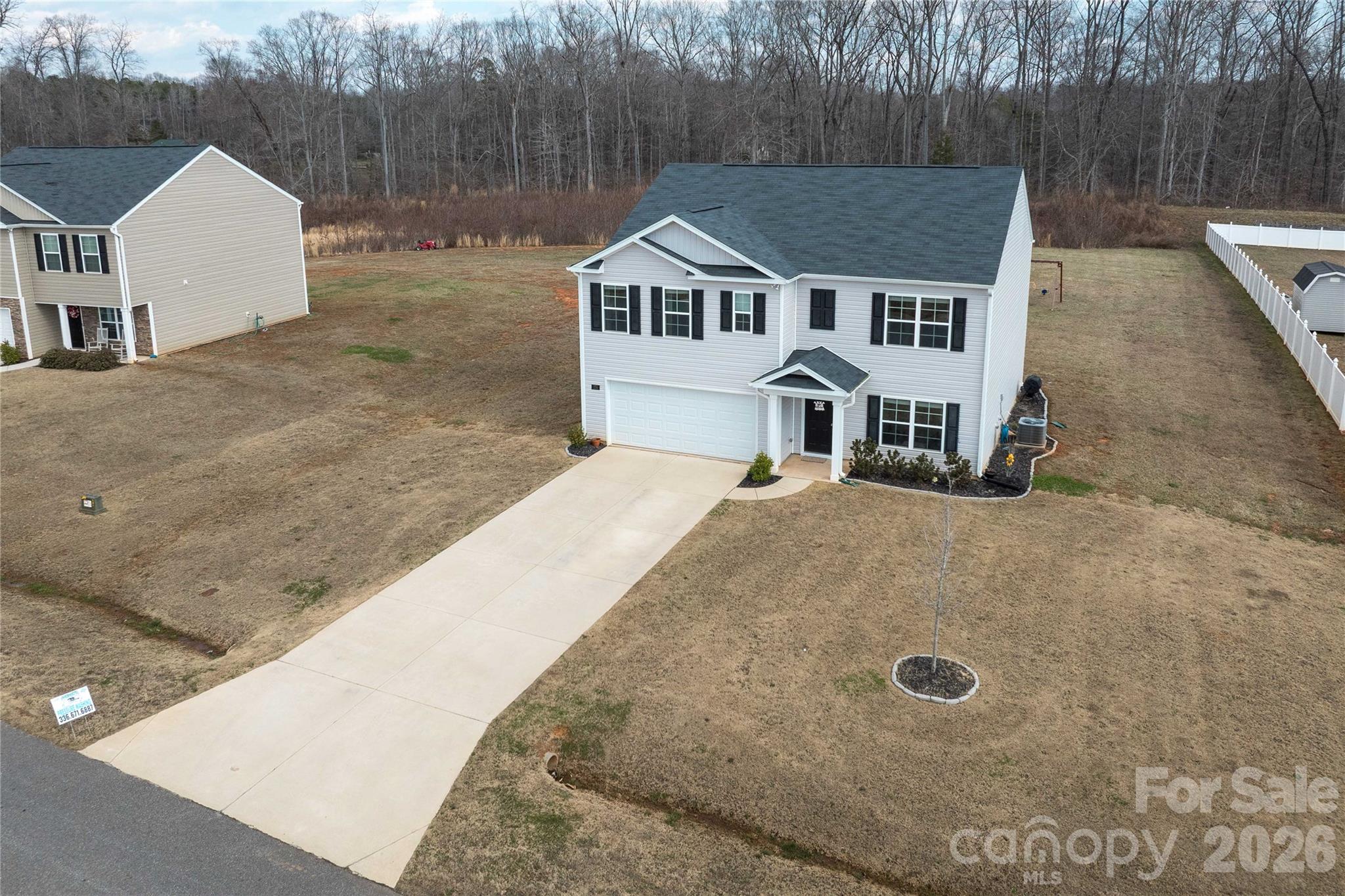 Motivated Sellers bring all offers. Move-in ready home with a flat backyard in the Highland Place community in Mocksville. Built in 2022, this 4-bedroom, 3-full-bath home offers over 2,500 square feet, with a flexible layout and potential for a 5th bedroom.
Main level features a bedroom or flex space with a full bath, perfect for guests or multi-generational living, along with an office ideal for working from home. The kitchen is built for entertaining with a large island, granite countertops, stainless steel appliances, and luxury vinyl plank flooring throughout the main level
Upstairs, you’ll find a spacious primary suite with an en suite bath and two walk-in closets. A loft area provides the perfect spot for movie nights or additional living space, along with three more generously sized bedrooms and a convenient upstairs laundry room. Outside, you will find a large patio overlooking a backyard.
Enjoy a peaceful setting just minutes from the interstate, shopping, and dining.