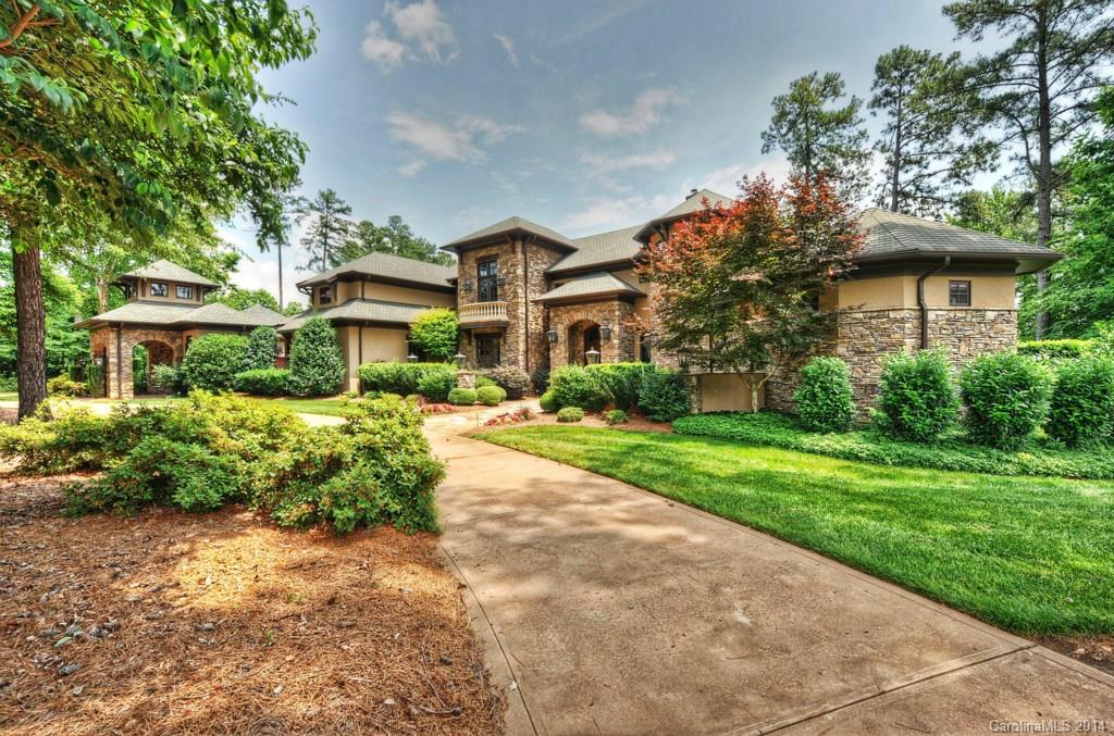 Sprawling 170 ft wide Tuscan style home offers LKN living at its finest! Built for entertaining & one of the largest panoramic views on LKN, home has 2255 sf of covered veranda to take in the views & entertain around the lake, pool, spa, cabana, bar & FP. You'll enjoy the outdoor living & features as much as the interior features.Total privacy from neighbors, your own private resort. 4 car garage.