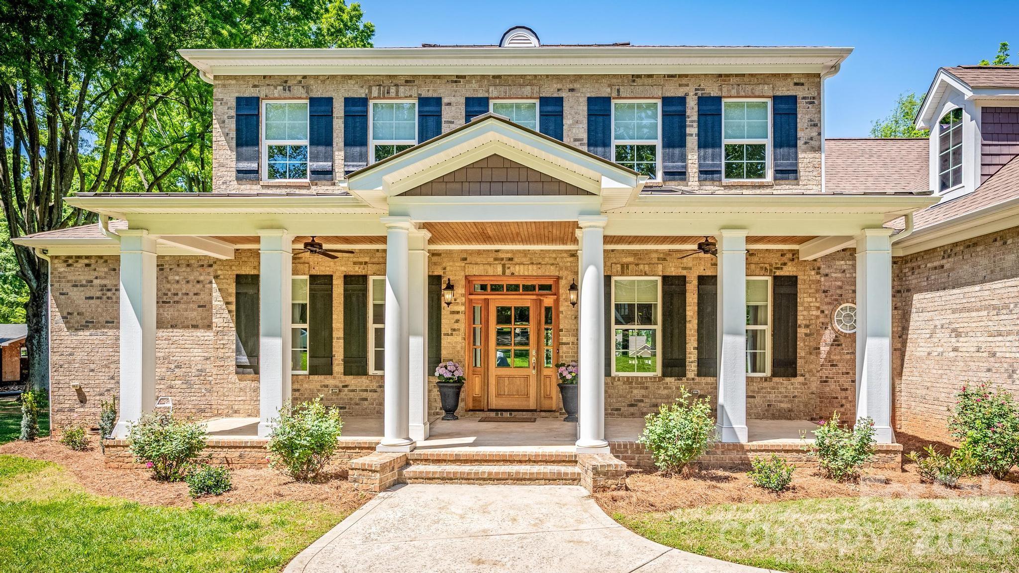 HIGHLY MOTIVATED SELLERS, MAKE US AN OFFER! The sellers need to move out of state. This gives you the rare opportunity to experience Lake Norman living at its best without the million-dollar price tag. Enjoy all the benefits of lake life without the expense and upkeep of a private dock. This exceptional home includes access to a community boat ramp and dock, offering effortless access to the water for boating, fishing, watersports, or simply soaking up the beauty of Lake Norman. Whether you're searching for a full-time residence or the perfect retreat, this property delivers the lifestyle you've been dreaming of.
From the moment you arrive, you'll be captivated by this stunning 4,100-square-foot, full-brick Southern Living–designed home, where timeless architecture, quality craftsmanship, and breathtaking water views come together to create something truly special.
Designed for both comfortable everyday living and memorable entertaining, the main level showcases rich hardwood floors, elegant moldings, and an inviting open-concept layout filled with natural light. At the heart of the home is a spacious gourmet kitchen featuring granite countertops, stainless steel appliances, a gas range, and a stylish tile backsplash—perfect for gathering with family and friends.
The luxurious main-level primary suite serves as a private retreat, complete with vaulted ceilings, dual vanities, separate walk-in closets, and a beautifully tiled walk-in shower. Also on the main floor are a private office, formal dining room, expansive living area with sliding glass doors leading to a screened porch with year-round water views, and a full laundry room.
Upstairs, you'll find two generously sized bedrooms connected by a Jack-and-Jill bath, an additional oversized bedroom with its own private ensuite, and a versatile bonus room ideal for a media room, game room, fitness space, or additional guest accommodations.
Set on more than three-quarters of an acre with no HOA, this property offers the rare freedom to enjoy Lake Norman living on your terms. Relax on the screened porch as the sun sets over the water, or unwind on the covered front porch with your morning coffee and favorite book.
What truly sets this home apart is its remarkable condition. Lovingly owned since new by a couple who used it only as a seasonal retreat, the home has never been occupied for more than four months per year. As a result, it shows with exceptionally minimal wear and has been meticulously maintained throughout its life. You'll enjoy the feel and condition of a much newer home without paying a new-construction premium.
Opportunities like this are rare—a beautifully designed lake-access home with water views, community boat ramp and dock access, no HOA, exceptional quality, and near-new condition. Move in, launch your boat, and start enjoying the Lake Norman lifestyle from day one.