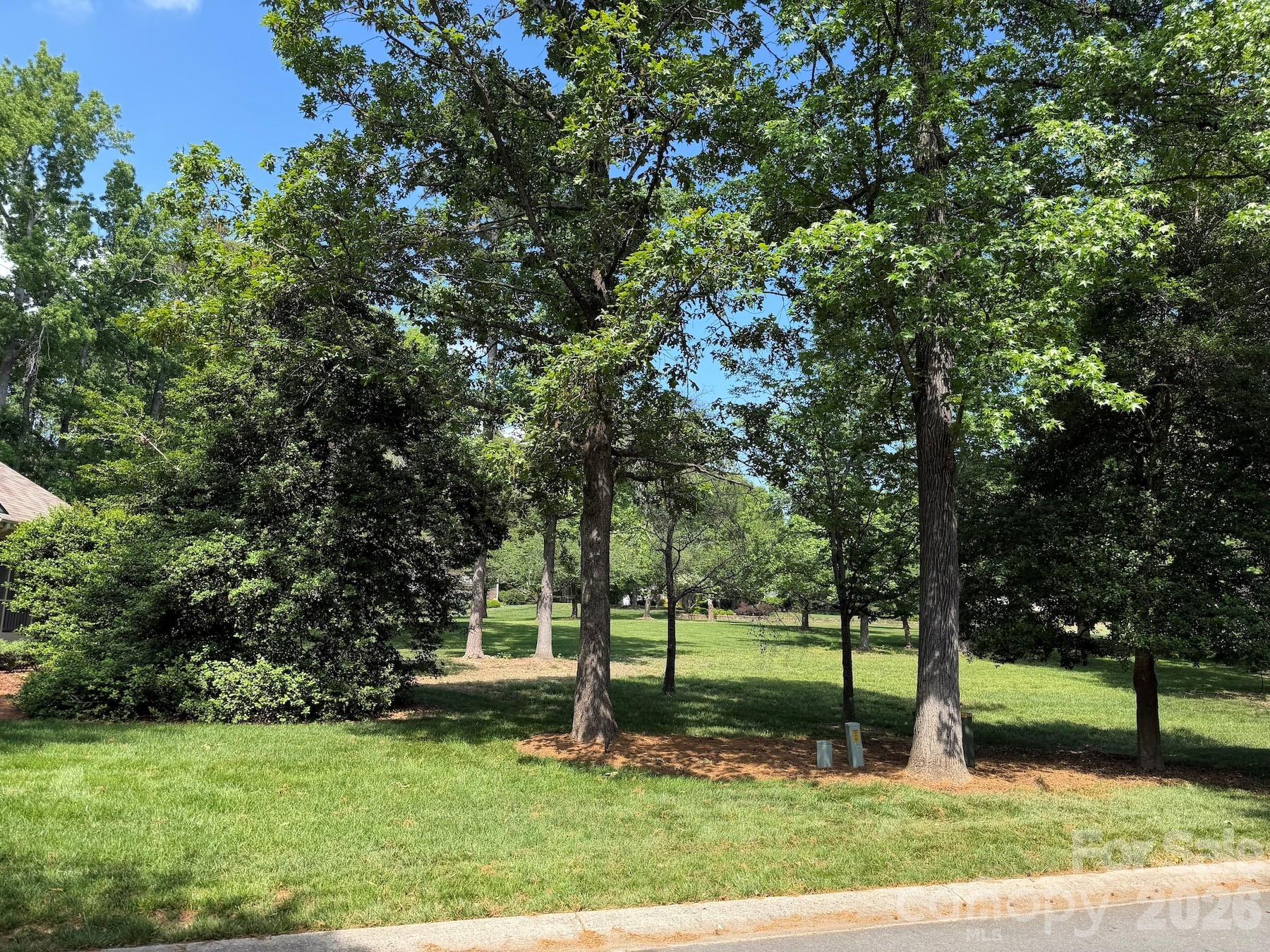 Beautiful level homesite in the Millingport neighborhood of Old North State Club's gated community! Build your dream home and enjoy exceptional views & the convenience of the community day dock and community putting green. The lot is an easy walk to Old North State Club amenities. Become a member of the Club for access to its recently renovated championship golf course, dining, pools, tennis/pickleball courts & more.