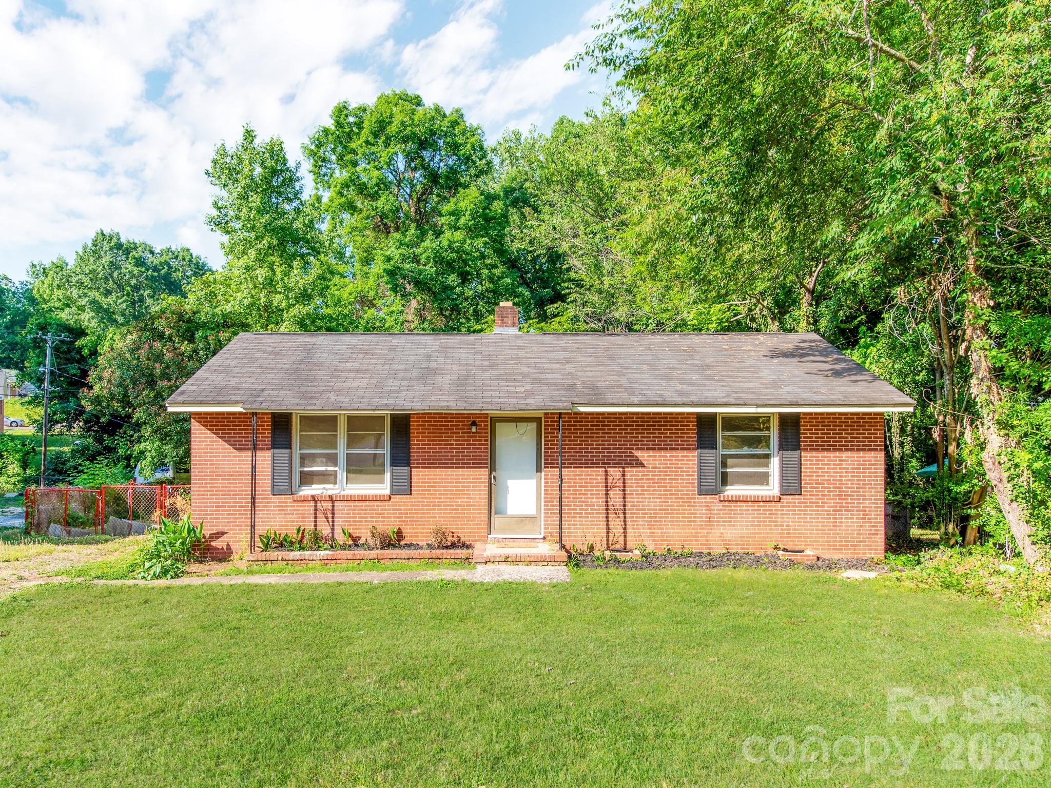 This charming 2-bedroom, 1-bath ranch home offers the perfect blend of comfort, character, and convenience. Step inside to discover a warm and inviting layout filled with cozy living spaces designed for easy everyday living. The kitchen provides plenty of cabinet space and a welcoming atmosphere for cooking and gathering. Both bedrooms are comfortably sized, making the home ideal for first-time buyers, investors, or anyone seeking low-maintenance living. Outside, enjoy a spacious yard perfect for relaxing, gardening, or entertaining guests. The classic ranch design offers single-level convenience and timeless curb appeal. Nestled in a desirable location close to shopping, dining, parks, and schools, this home combines peaceful living with everyday accessibility. Whether you're searching for a starter home or a smart investment opportunity, this adorable property is ready to welcome you home.