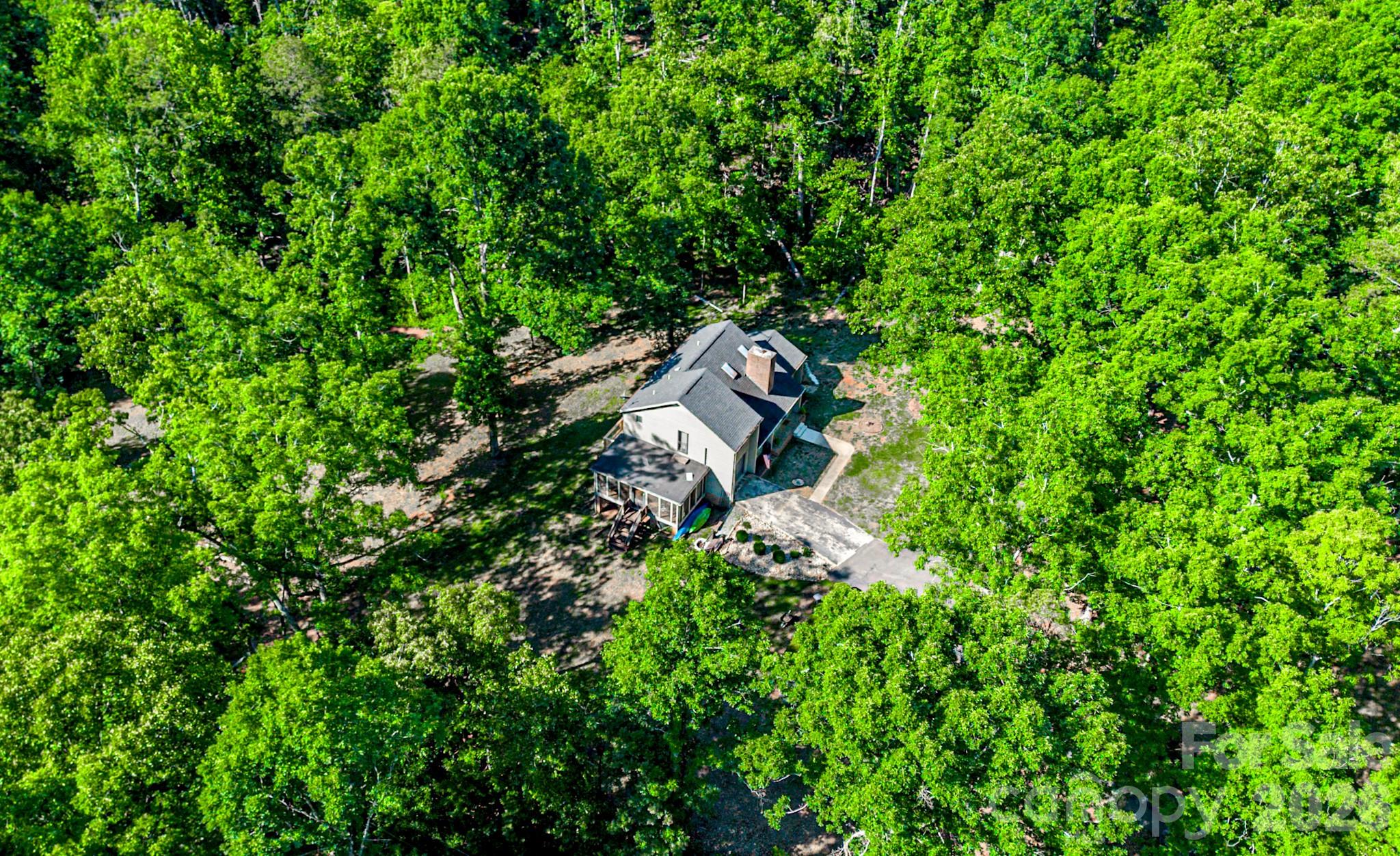 **Now Offered at $399,639 | 2.51 Acres Near Downtown Forest City**

Privacy, space, and future potential all in one. This **3-bedroom, 2 full bath + 2 half bath home** sits on **2.51 acres** just minutes from downtown Forest City, offering the kind of flexibility today’s buyers are searching for.

With approximately **1,915 heated square feet** plus a **walk-out basement with over 1,500 additional square feet**, this property gives you room to live now and expand later. The basement already includes a half bath and exterior access, making it ideal for future recreation space, a home gym, workshop, guest area, media room, or additional finished living space.

The main level features a comfortable living room with fireplace, a functional kitchen with ample cabinetry, and a dedicated office or flex space, perfect for working from home, hobbies, or everyday organization. Upstairs, the primary suite includes dual closets and a tiled shower, along with two additional bedrooms and shared bath access.

Step outside and enjoy the space buyers keep asking for:

**Outdoor features include:**

* Screened porch, approximately **13' x 23'**
* Rear balcony overlooking the property
* A mix of cleared and wooded acreage
* Private setting with usable outdoor space
* Attached garage with interior access
* Semi-circular driveway with additional parking
* Community well

Homes with acreage, privacy, usable space, and expansion potential under $400K are hard to find in the Forest City area. This property is positioned for buyers who want more room, more flexibility, and more long-term possibilities without stretching past the $400,000 mark.

**Schedule your showing and come see how much space this property really offers.**