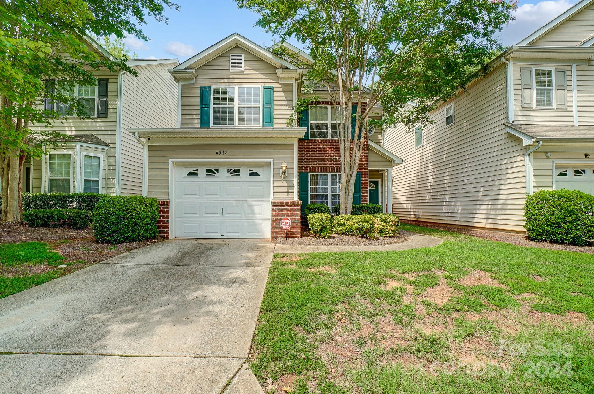 Welcome to this inviting 3 bedroom, 2.5 bathroom townhouse located in Villages of Avonlea, ideally situated 15 minutes from Uptown with convenient highway access. The home features a bright open living space with LVP flooring newly installed in 2021, a gas fireplace, and a kitchen with bar seating perfect for entertaining guests. The primary suite is a tranquil retreat with a walk-in closet and an en-suite bathroom including a garden tub. Additional highlights include a back patio, an attached garage, and a community pool.