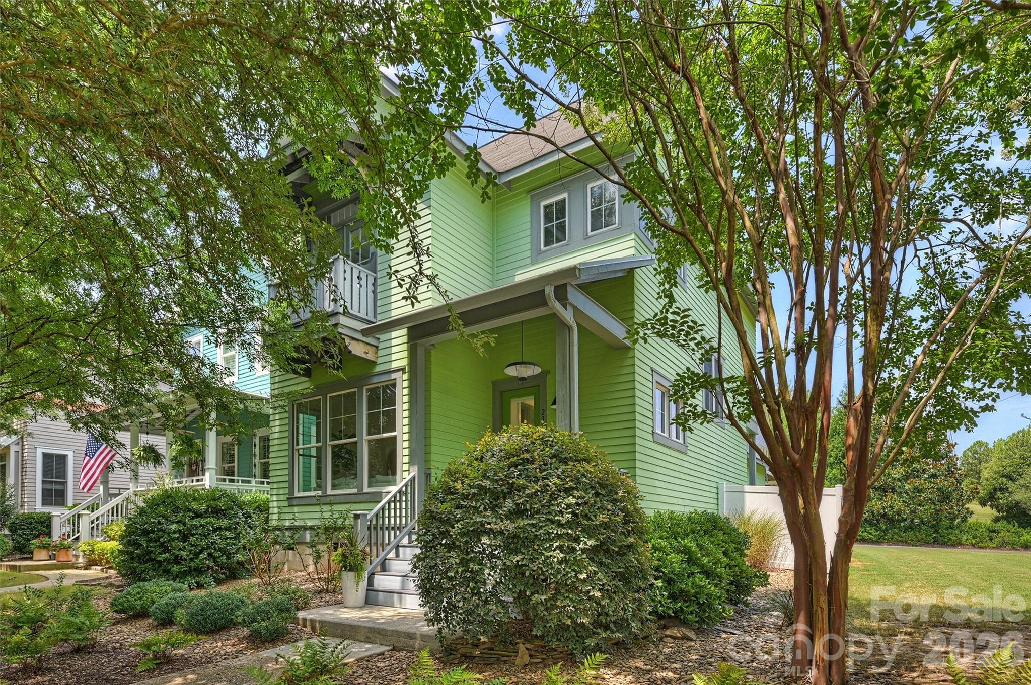 Welcome home to this thoughtfully updated Baxter Village gem, where timeless character, quality improvements, and an unbeatable location come together to create a home you'll love for years to come.

Sitting on a corner lot abutting HOA green space, this home is filled with natural light. There are so many extra  home features - soaring 10-foot ceilings on the main level, beautiful hardwood floors throughout, Benjamin Moore Swiss Coffee paint, an updated wool stair runner, and elegant judges paneling that adds warmth and architectural charm. At the heart of the home, a stunning see-through double-sided gas fireplace with built-in bookshelves on both sides creates a cozy focal point, seamlessly connecting the living spaces for everyday living and entertaining.

The kitchen offers both style and function with updated Calacatta Classic quartz countertops, a large peninsula with bar seating, stainless steel appliances, an oversized stainless steel sink, and updated lighting fixtures throughout the home. Every closet has been enhanced with custom wood shelving, providing beautiful, functional storage throughout.

The spacious primary suite serves as a peaceful retreat, featuring a private balcony overlooking mature trees—perfect for enjoying your morning coffee or unwinding at the end of the day. The ensuite bath offers an oversized soaking tub, a walk-in shower with a built-in bench, and a spacious layout designed for both comfort and relaxation.

Additional thoughtful upgrades include Google Nest smart thermostats, an updated AC unit and hot water heater, and a detached, finished two-car garage complete with an additional storage closet.

Step outside to a backyard designed for easy living. The professionally installed turf provides a lush green lawn year-round with virtually no maintenance, while the brand-new six-foot white vinyl privacy fence creates the perfect setting for entertaining, relaxing, play or pet retreat.

Perfectly situated in the heart of Baxter Village, this home offers the walkable lifestyle buyers are searching for. Enjoy an easy stroll to Market Street's shops, restaurants, coffee spots, community events, pools, parks, tennis courts, playgrounds, and the Baxter YMCA. With convenient access to I-77, Kingsley Town Center, Anne Springs Close Greenway, downtown Fort Mill, and Fort Mill's highly rated schools, you'll be close to everything while enjoying one of the area's most sought-after communities.

Homes that combine thoughtful updates, low-maintenance outdoor living, and Baxter Village's unmatched lifestyle don't stay available for long. Schedule your private showing today and experience everything this exceptional home has to offer.